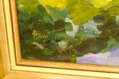 Portrait of a Girl Sitting in a Summer Garden