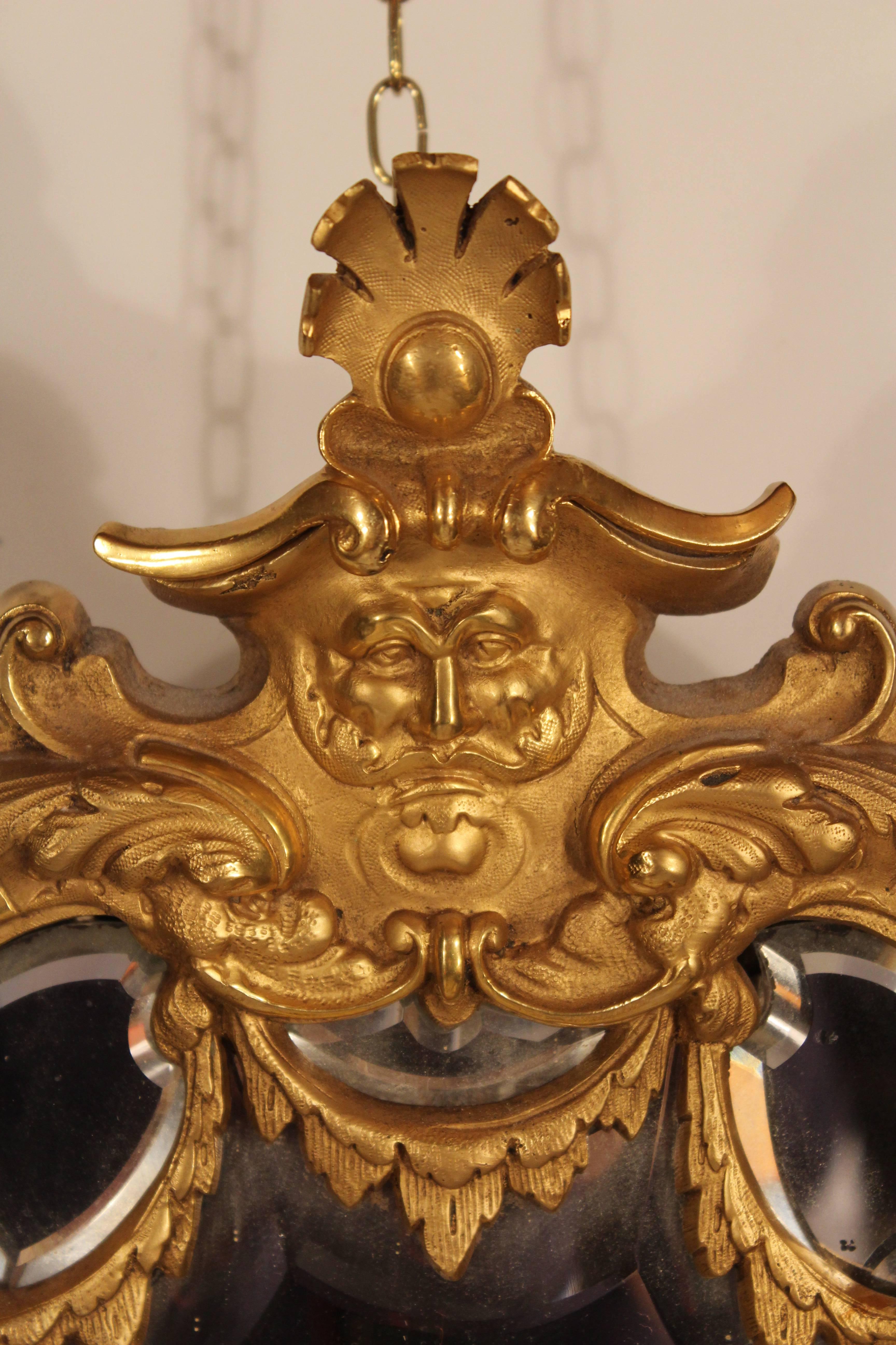 Exquisite pair of mirrored appliques, gilded bronze. Two of the three candleholders on each appliques have been electrified in the 20th century (European). Shipping from Germany to NYC or Boston is included.