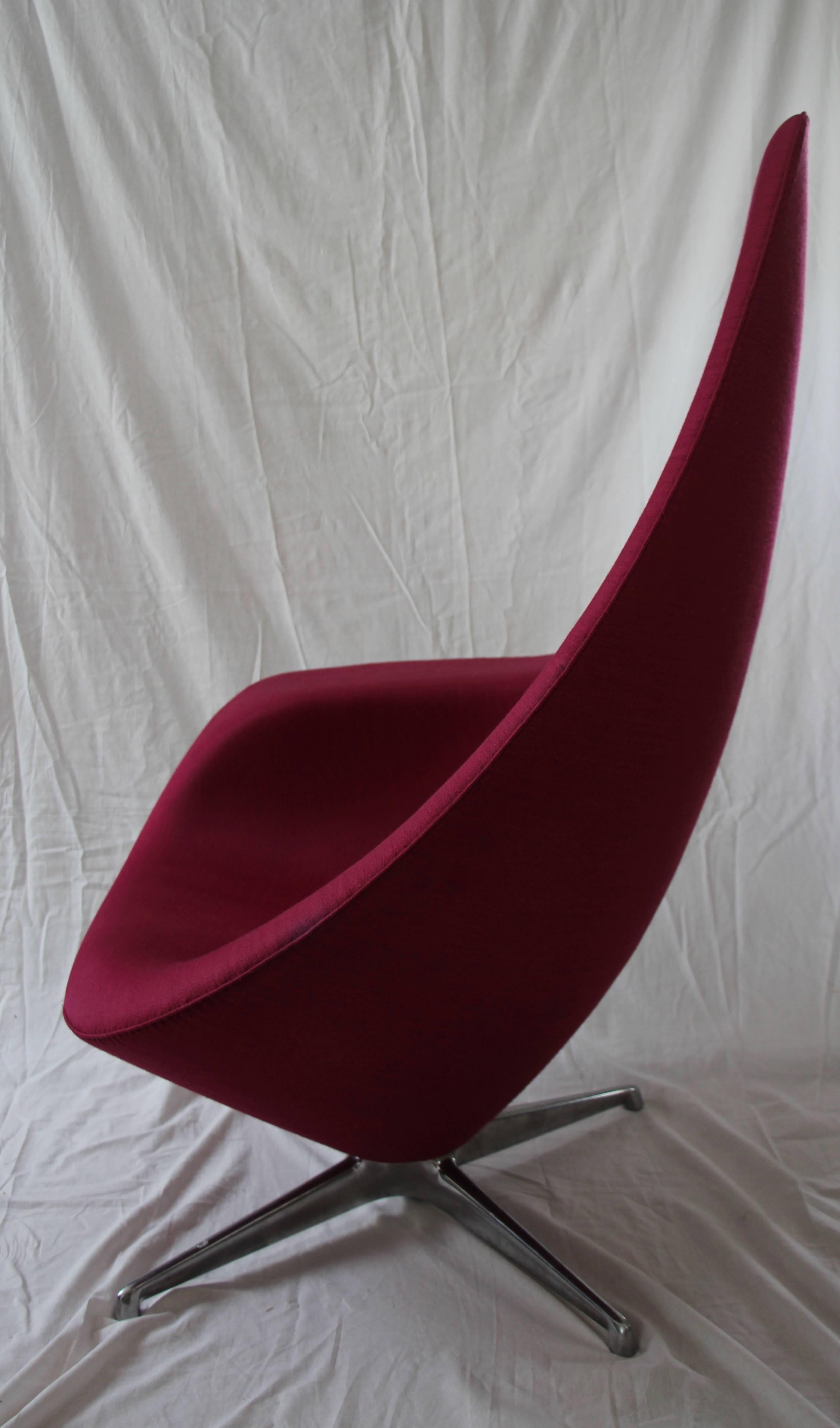 Erik Magnussen (Danish, 1940-2014) for Engelbrechts, circa 2009. A contemporary swivel 'Plateau' lounge chair in hard foam, affixed by polyurethane foam shell and covered in two pieces of fushia colored fabric, one for the seat and one for the back,