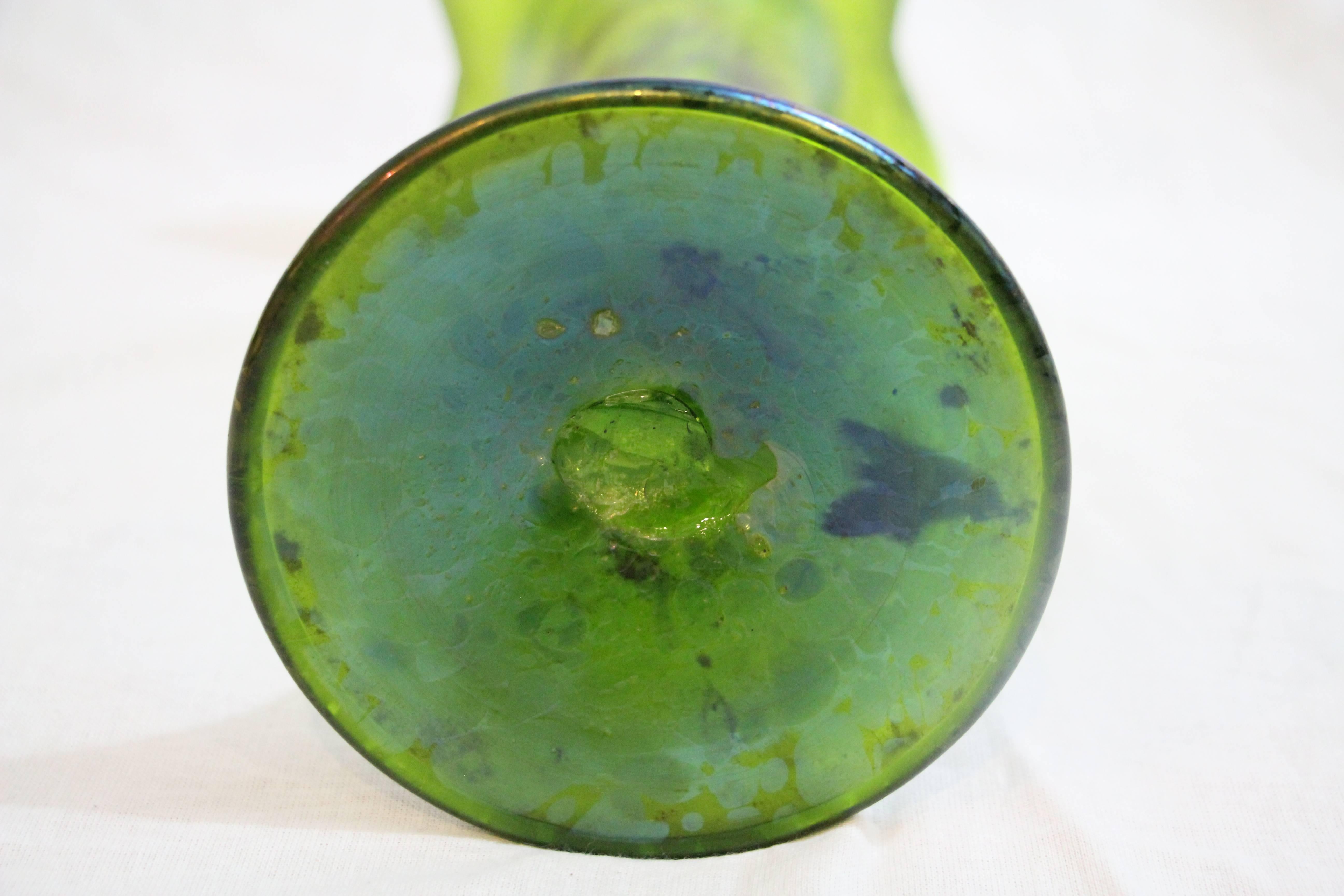 Art Nouveau glass vase, probably European, circa 1920. Green iridescent handblown glass. In the style of Loetz Austria.