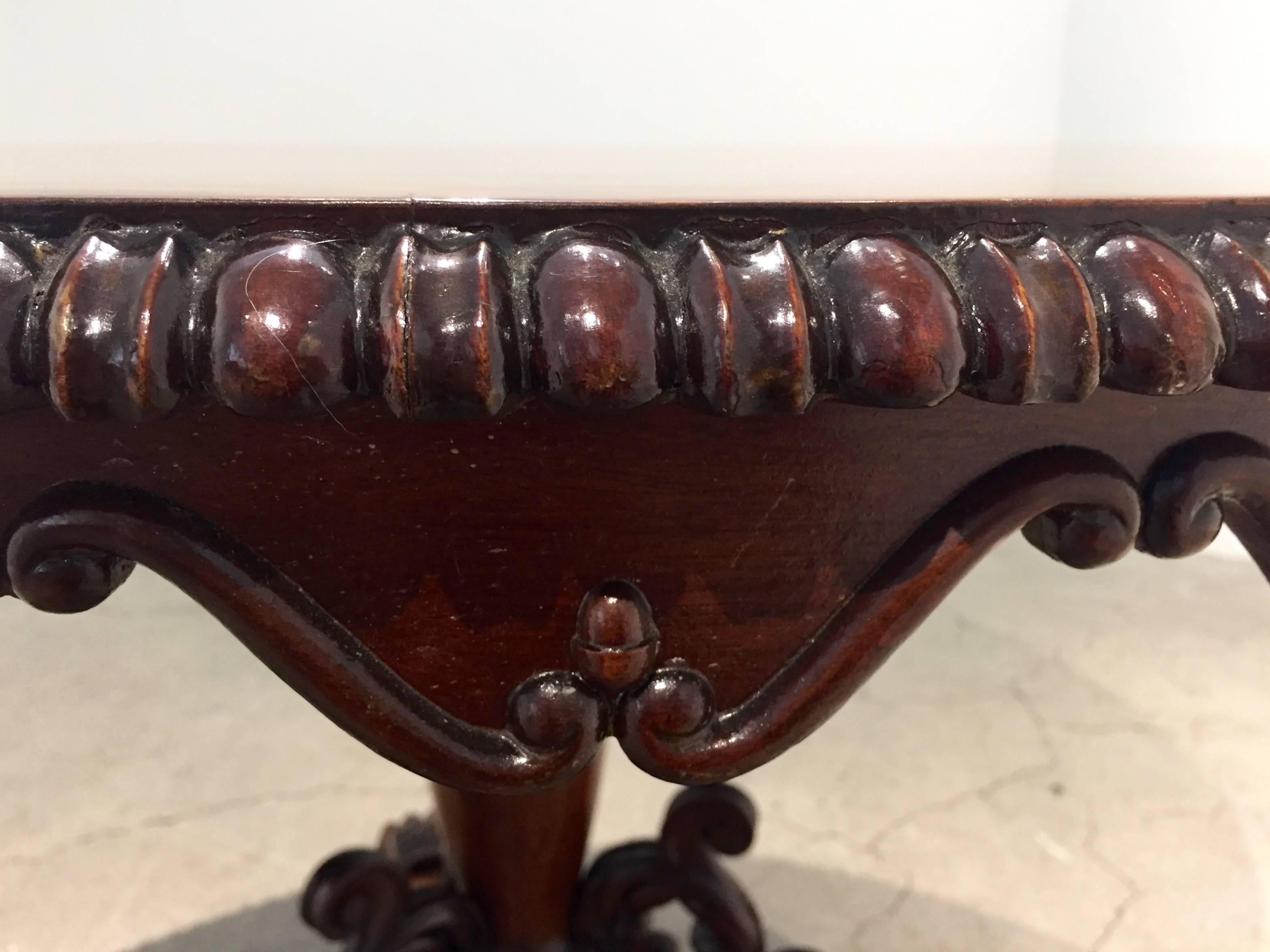 Unique centre table, England, circa 1850, mahogany. beautifully carved details.  
 