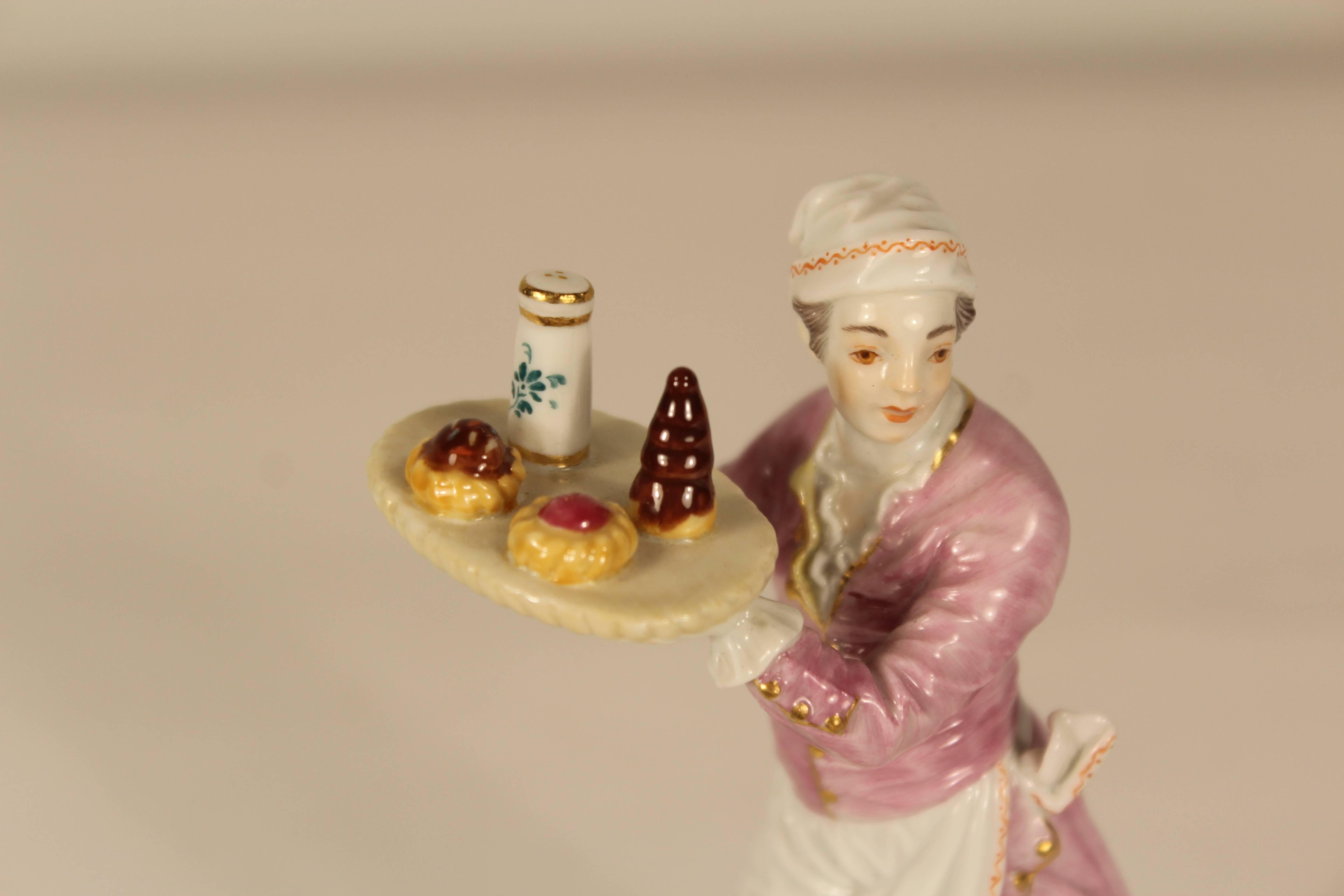 Meissen porcelain figurine of a man selling pastry, Germany, circa 1920. One of the street sellers of Paris series (Cries de Paris) originally modeled by Peter Reinicke in 1755.
Underglaze blue crossed swords, impressed 6022 6, painter mark 56.
   