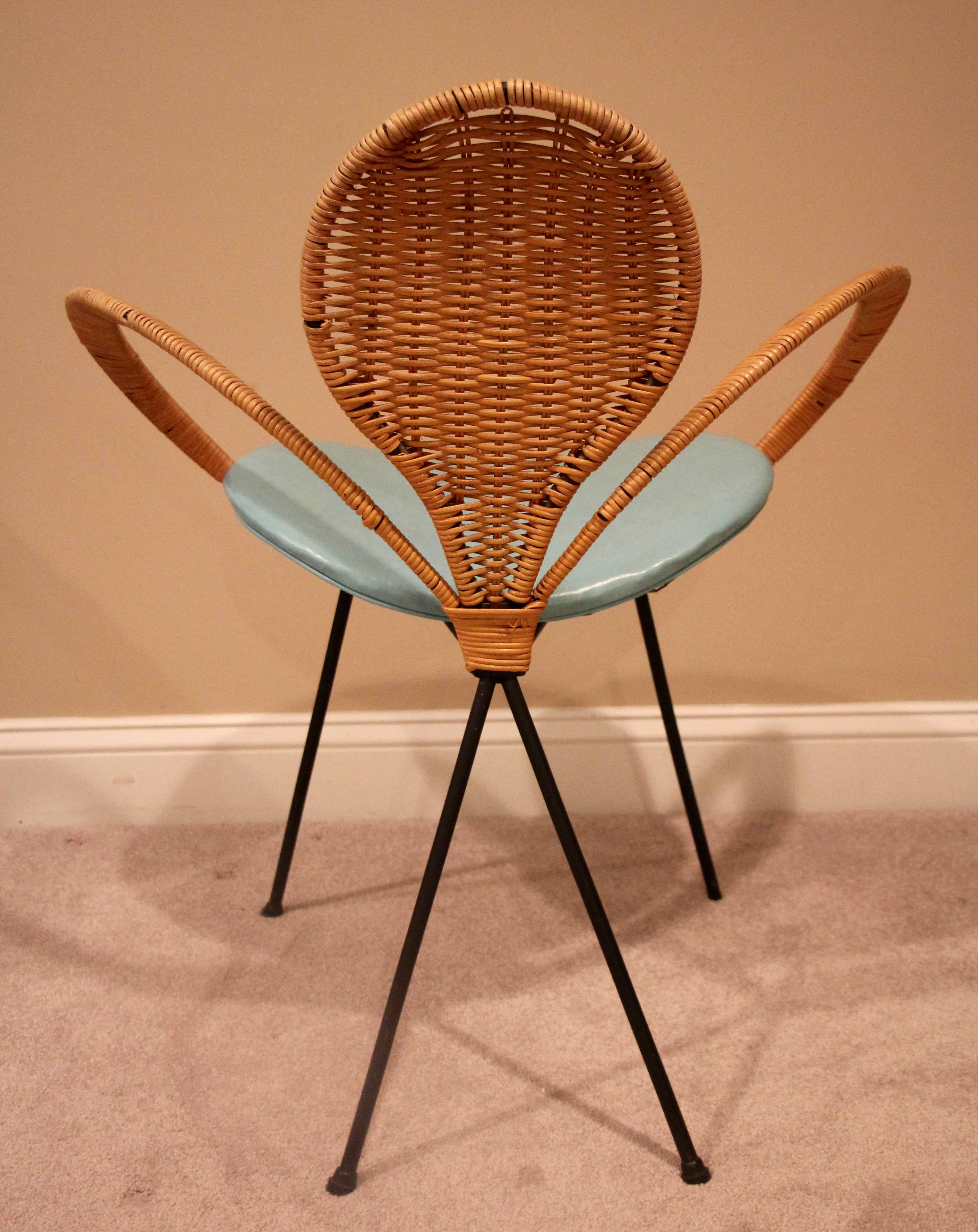Mid-Century style rattan ribbon chair with iron legs.
