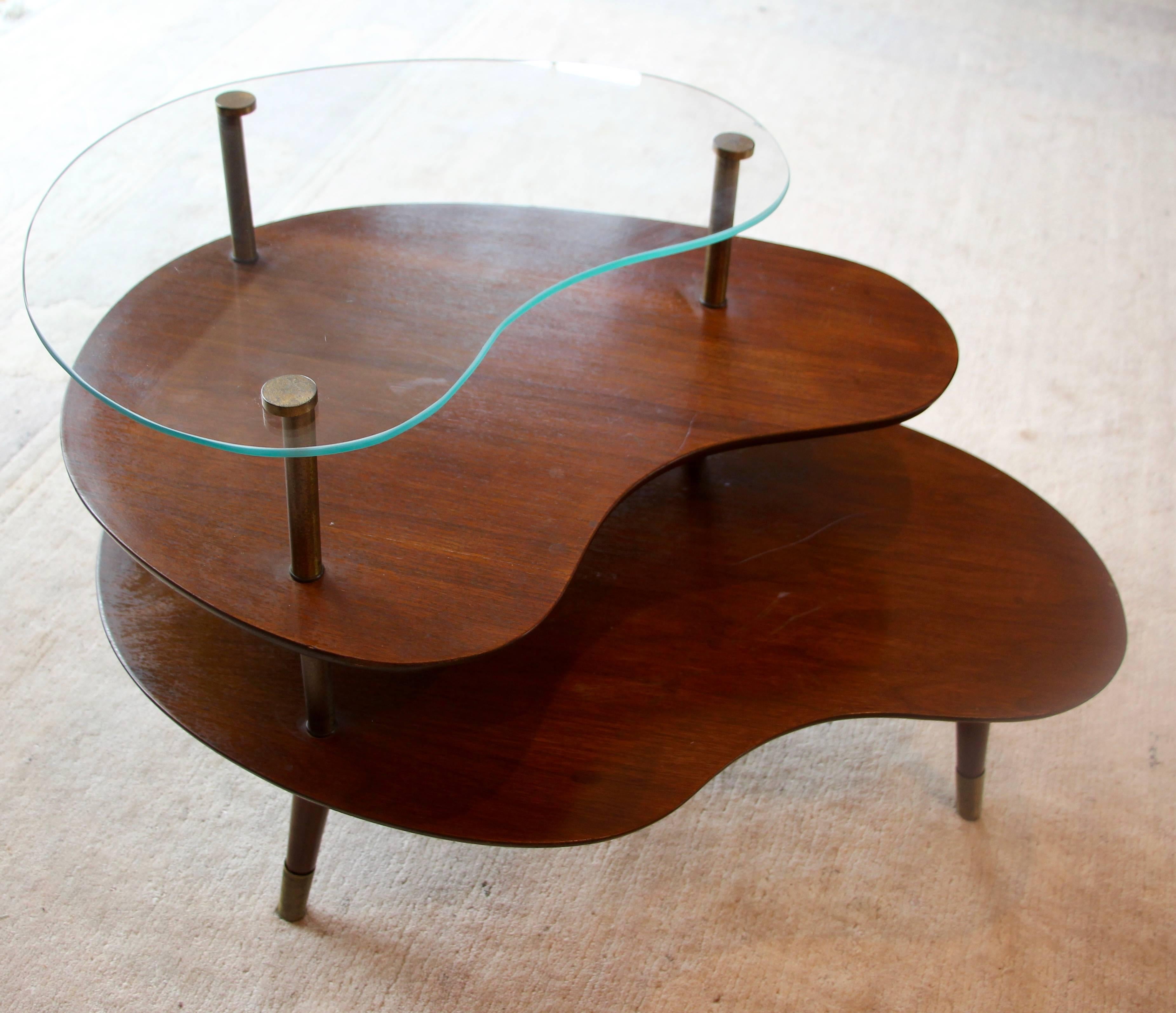 Original 1960s side table, three tiers, walnut and glass. Vintage condition.