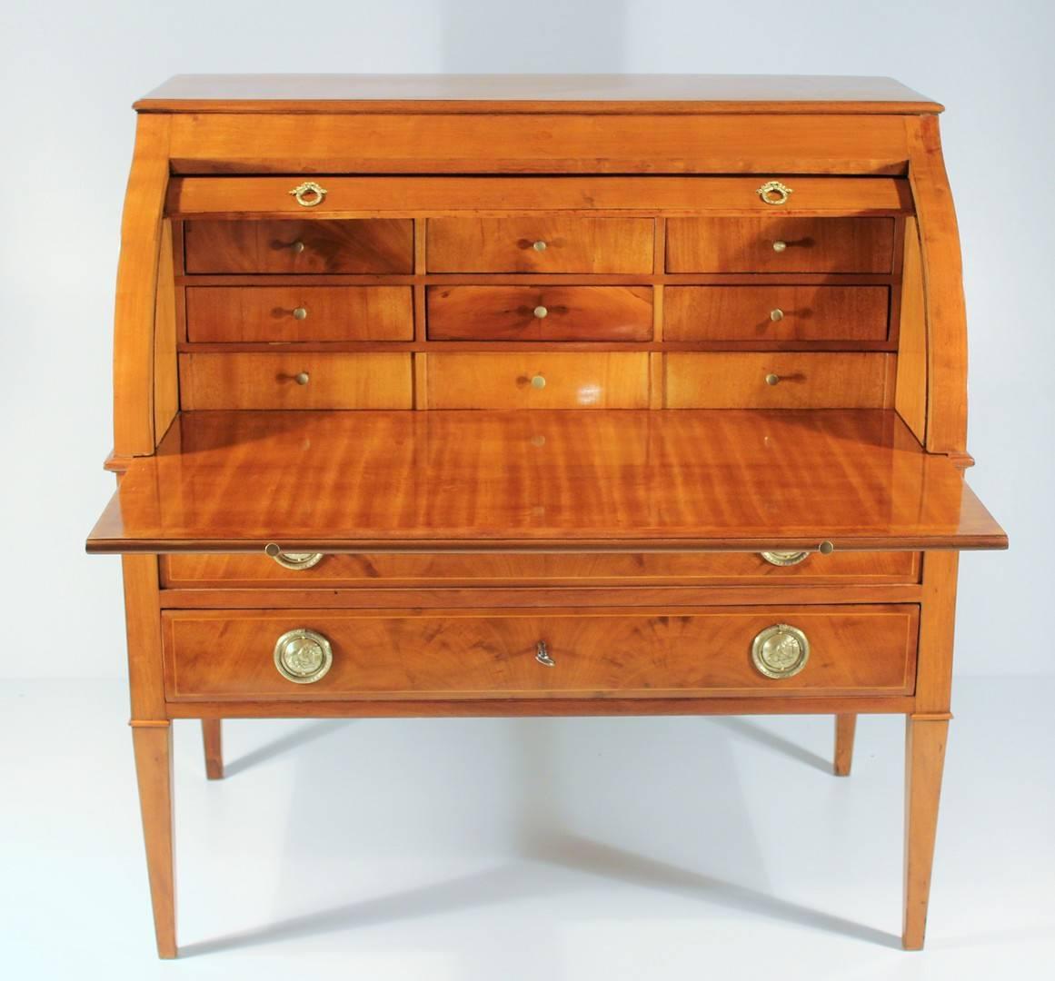 Rolltop writing desk with nine interior drawers, the exterior with two drawers, raised on cabriole legs. Bleeched mahogany veneer. The secretaire is in excellent condition. It will be shipped from Germany. Shipping costs to Boston are included.