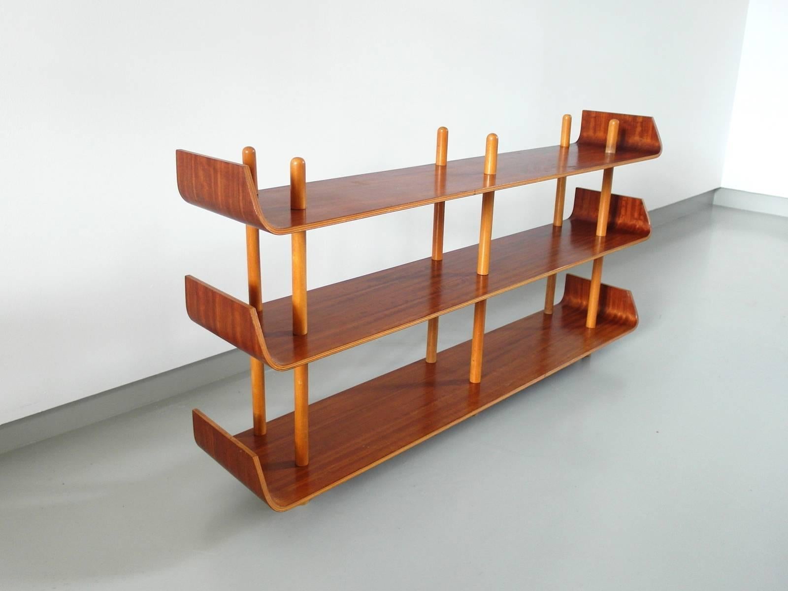 Shelving unit in plywood, designed by Willem Lutjens for Den Boer Gouda, the Netherlands, 1953. 
Beautiful and rare item with a nice open structure. Elegant and timeless design. These units were produced in different varieties. This model with