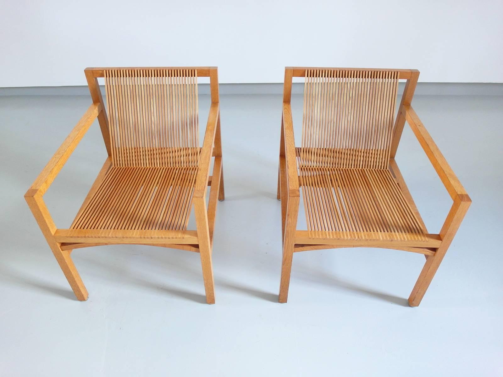 Elegant and light pair of easy chairs designed by Ruud Jan Kokke for Metaform in 1984. The 'Kokke' chair or "Latjes-stoel", designed in 1984 and inspired by the work of Gerrit Rietveld, shows Ruud-Jan Kokke's passion for material and