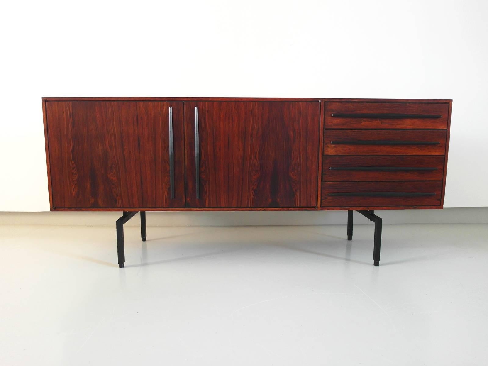 A very sleek and light high quality sideboard, Italy, circa 1955. This small sideboard has beautiful details and is made from high quality materials. The back of the sideboard is finished with rosewood as well, so it would also be possible to use it
