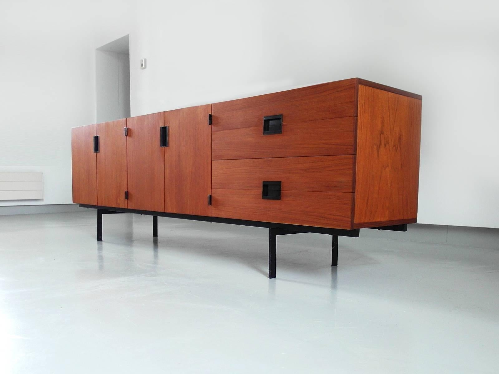 Minimalist sideboard designed by Cees Braakman for Pastoe, the Netherlands, 1958. This highly collectable DU03 sideboard is regarded as a true icon of Dutch Mid-Century Modern design. The sideboard has an outstanding clean geometrical design with a