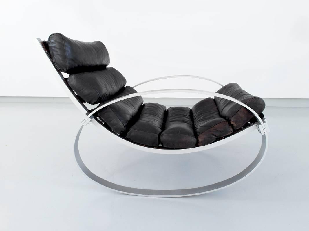Rare rocking chair designed by Hans Kaufeld, Germany, circa 1970. 
Beautiful lounge chair with original soft black leather cover with a beautiful patina. The sculptural frame of the chair is made of brushed aluminium and finished with beautiful