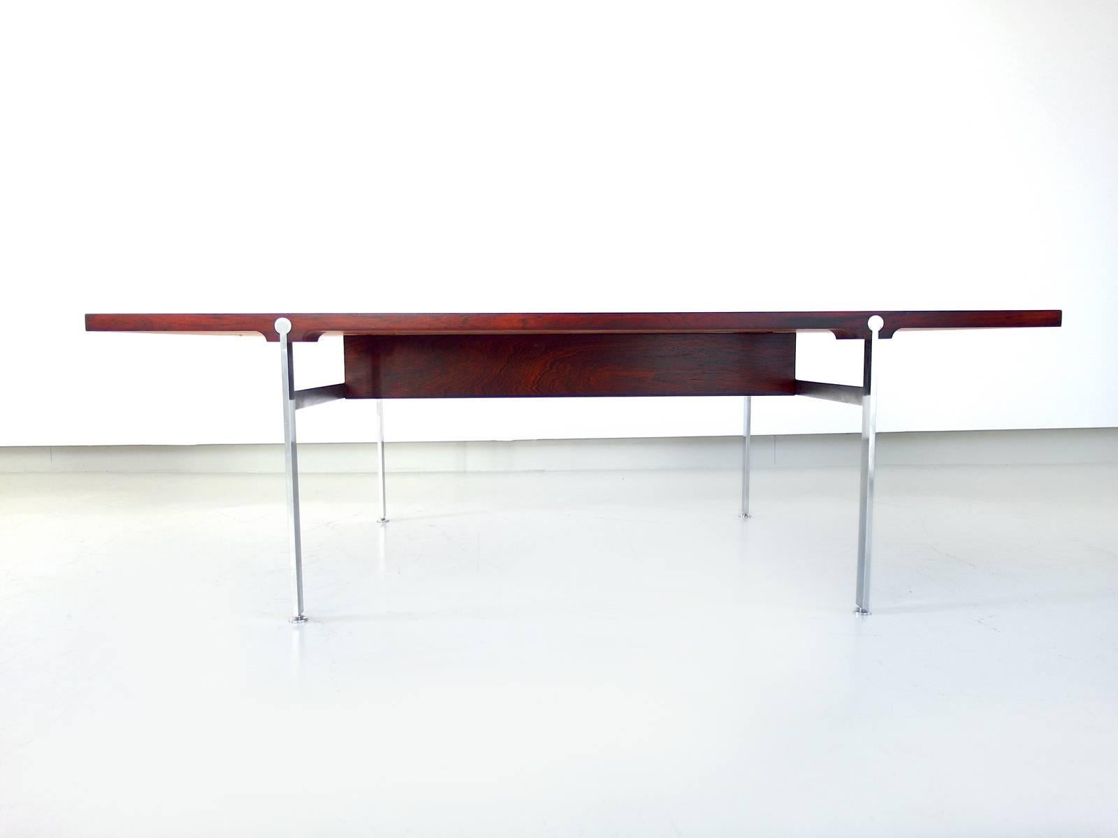 Rare coffee table designed by Illum Wikkelsø for Søren Willadsen Møbelfabrik, Denmark, 1960s. A large coffee table  with refined metal details and metal inlay. The table top has been restored and finished with a water - and UV protective lacquer.