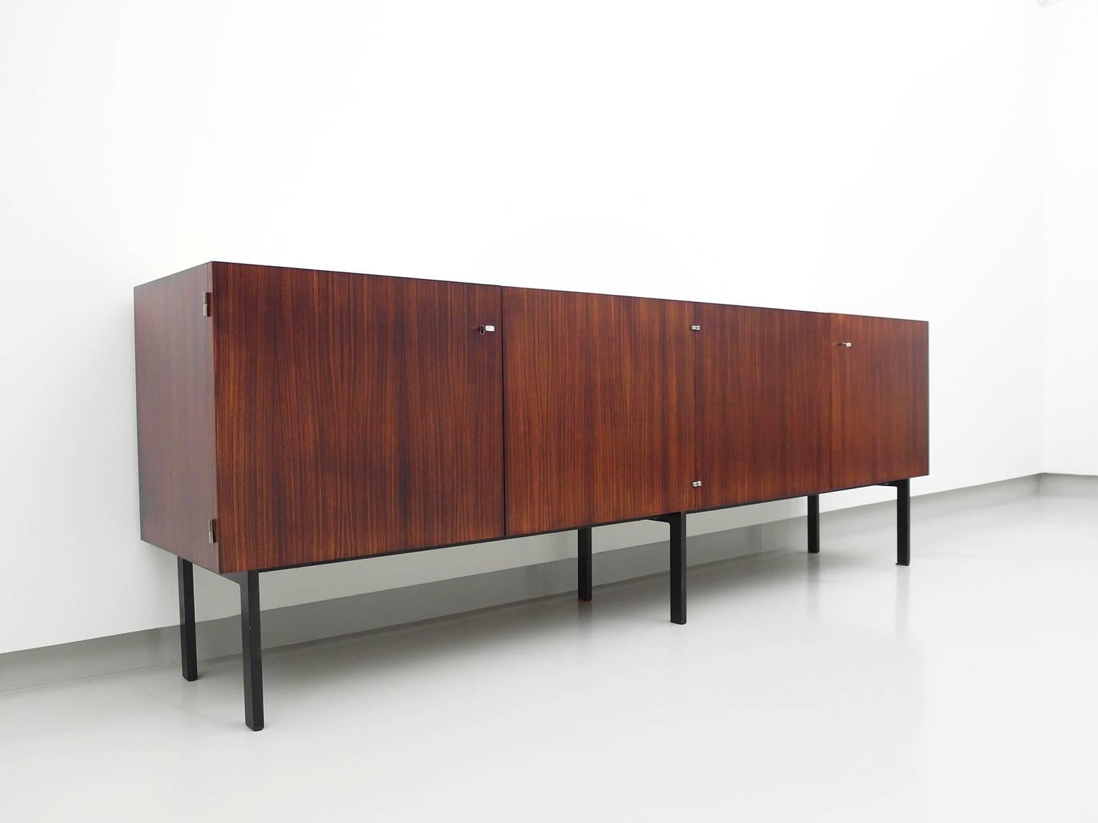 High quality rosewood sideboard with travertine top attributed to Etienne Fermigier for Meubles et Function, France 1961. Exceptionally well made sideboard. Oak construction, beautiful hidden hinges and high quality rosewood veneer. The travertine