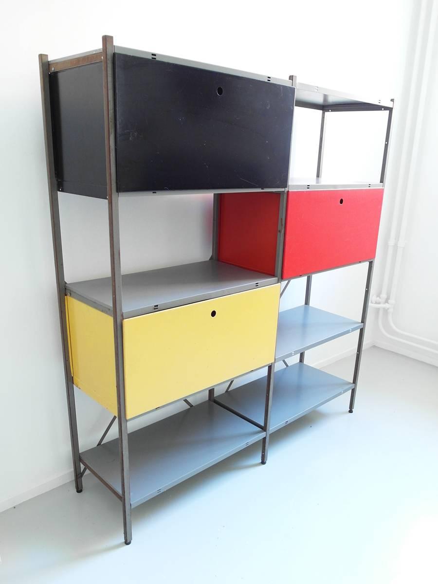 Colorful Industrial metal storage cabinet by Wim Rietveld for Gispen, the Netherlands 1954. This cabinet would be suitable as a storage unit or bookcase and would be perfect to use as a room devider. 
This cabinet comes with three cases. A black,