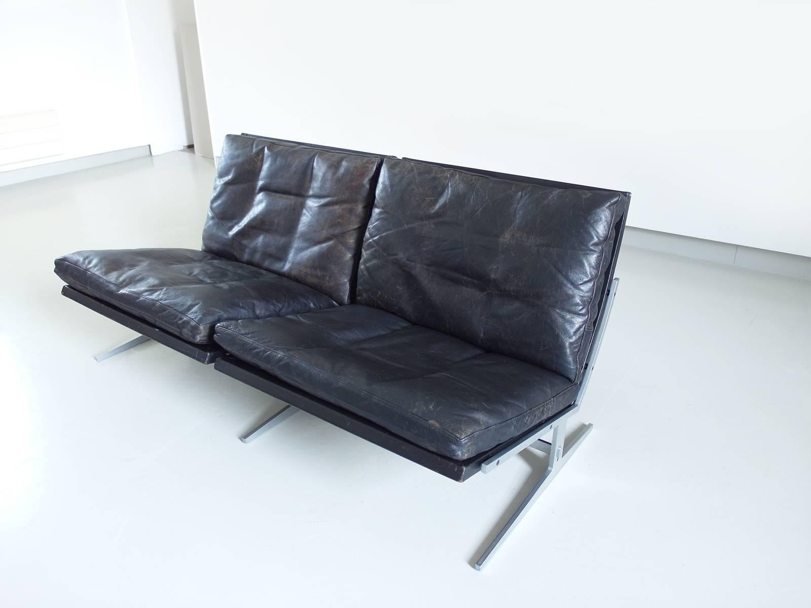High quality two-seat sofa model BO562 in brushed steel and black leather, designed by Preben Fabricius and Jørgen Kastholm, manufactured by Bo-Ex, Denmark, 1962. 

Designed in 1962, this BO562 lounge chair remains an extraordinary modern and