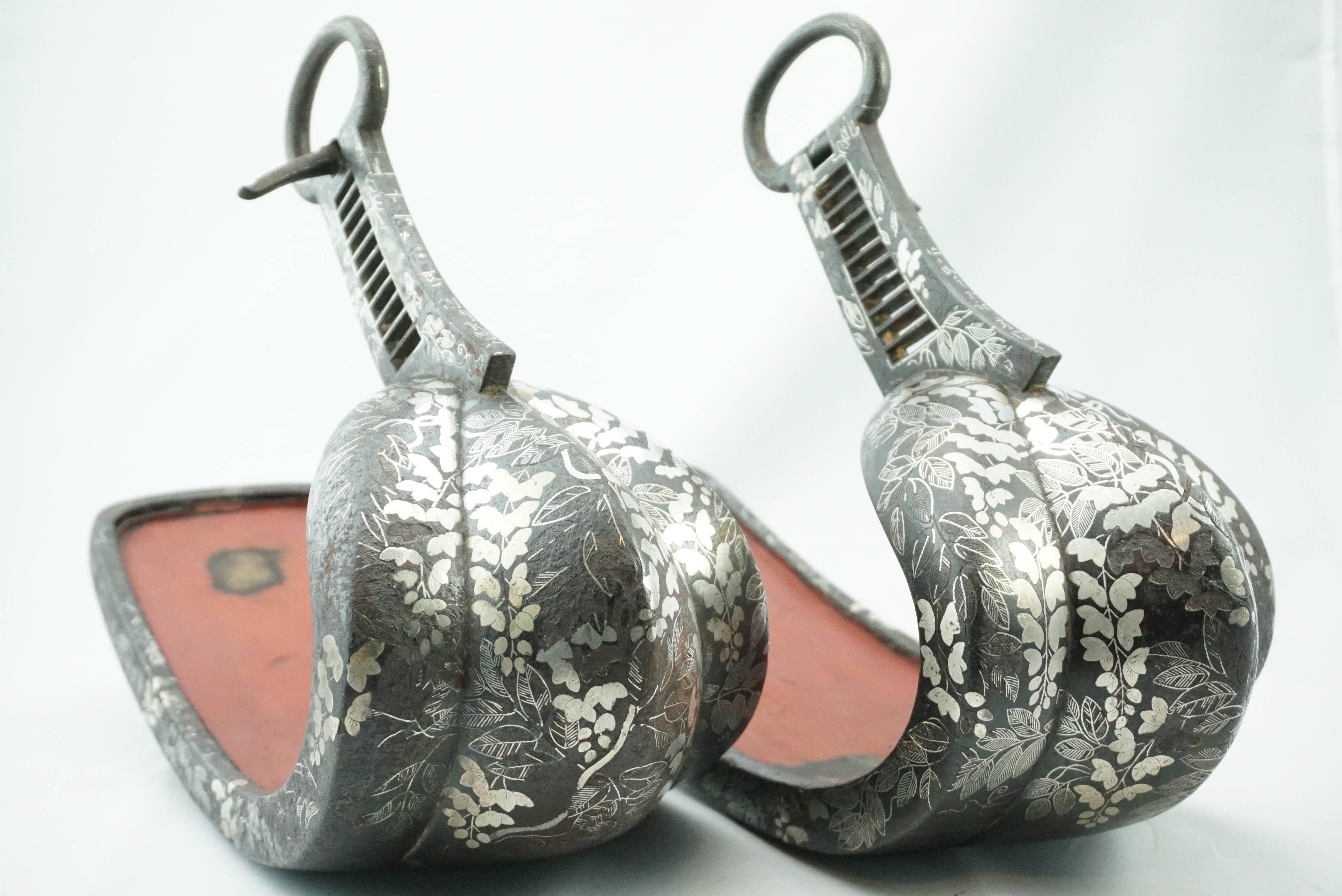 Pair of edo period 18th/19th century silver inlaid Abumi Japanese iron Stirrups. Signed Samurai Abumi with inlaid designs of leaves, peony, flowers and vines. These Abumi were well used and show beautifully. Museum quality! Pre Meiji period.

Signed