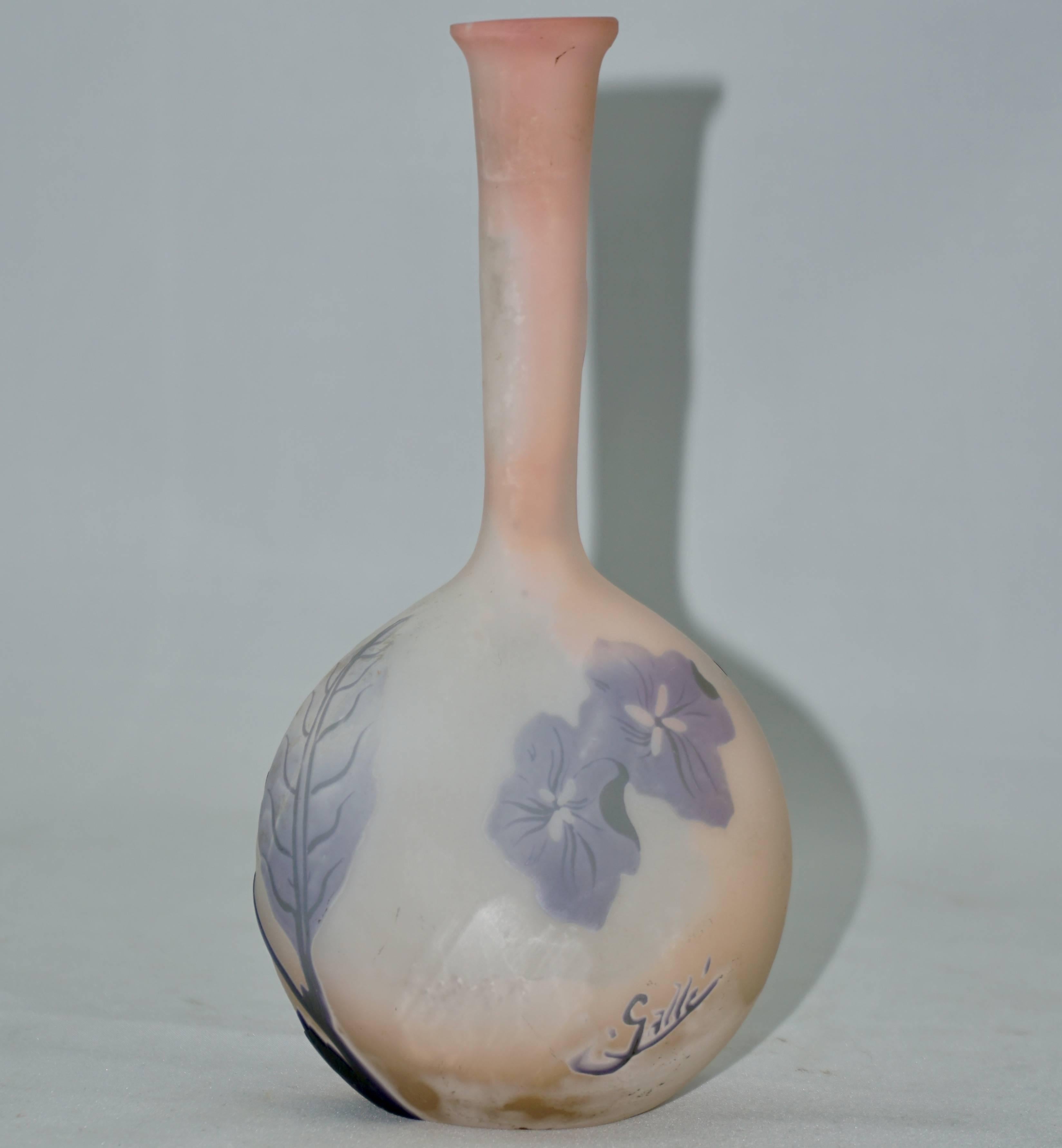 Emile Galle French Art Nouveau floral Banjo vase, circa 1904.
This soliflor opaque glass wheel carved and acid etched cameo vase has back ground colors of pink and cream with the foreground beautifully etched with flowers in lavender and