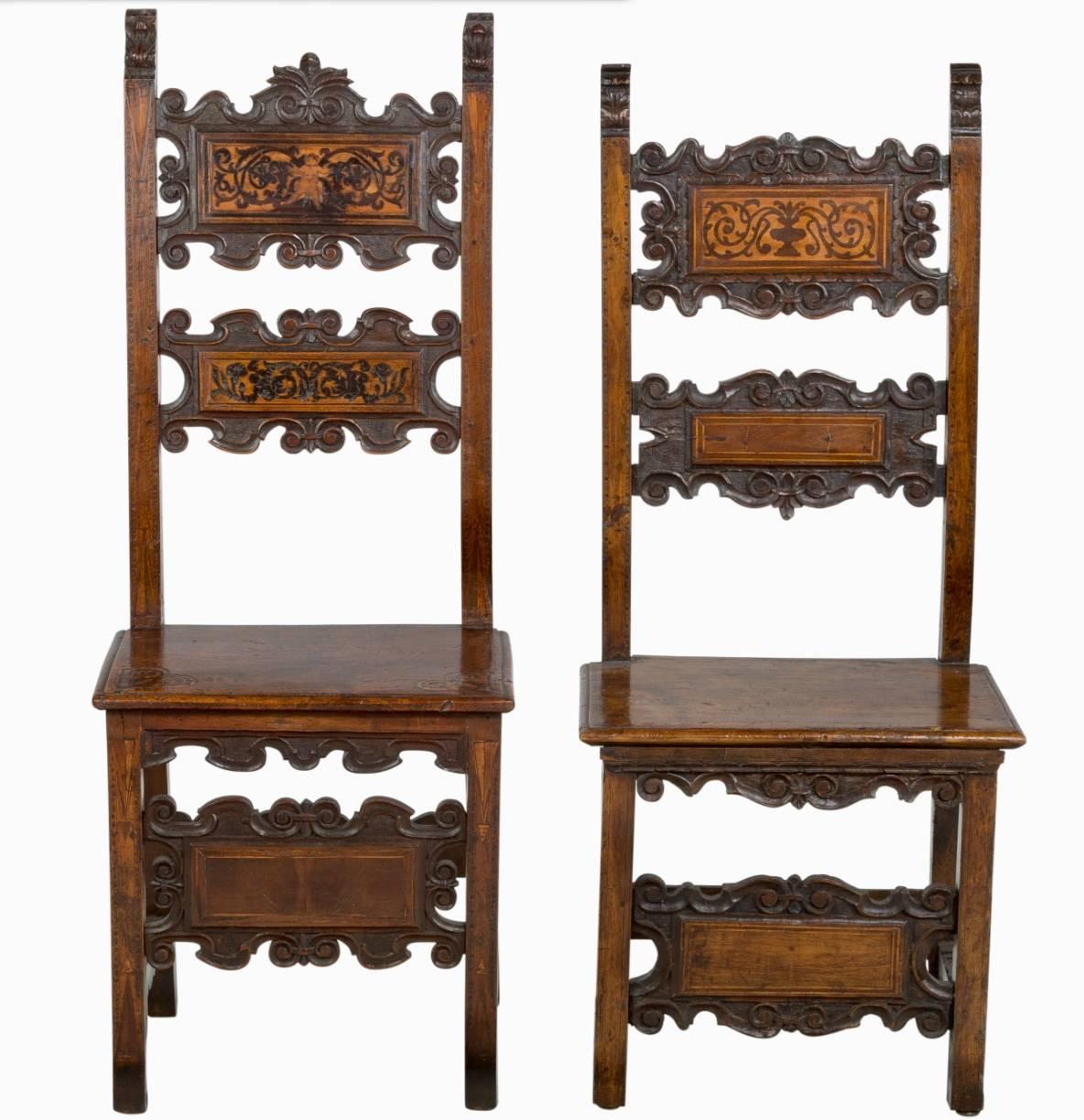 Pair of Lombardian maple and walnut post chairs, 17th century. Richly hand-carved and inlaid in maple and walnut perfect for accent or hall chairs. Design and dimensions are not identical.

Dimensions: 
Height 47.75 inches 
Width 20,25