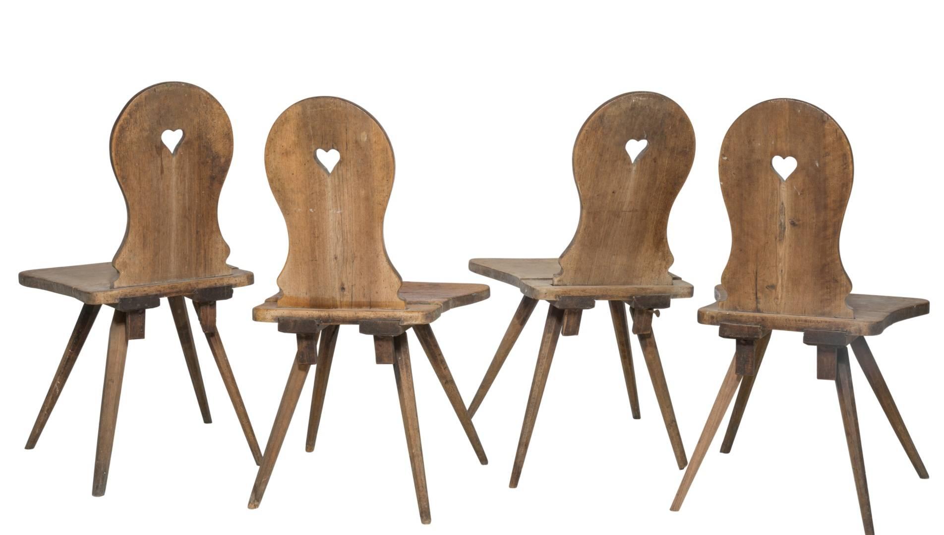 Set of Four Swiss German or Austrian oak country board chairs perfect for the kitchen. Tyrolean Alpine Rustic design. 

Dimensions:
Height: 35 inches
Width: 19 inches 
Depth: 14.5 inches 
(88.9 x 48.3 x 36.5 cm)

Provenance: The Ritter Antik