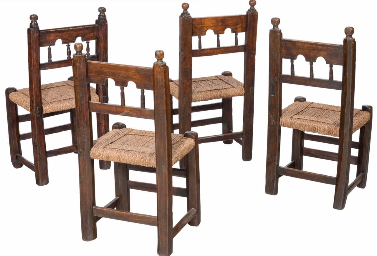 Four Moorish-Spanish post chairs for Connoisseurs and collectors of earliest available authentic furniture. From a monastery on the Balearic Islands of the coast of Spain. Perfect for your refectory table, dining, breakfast table or in the hall