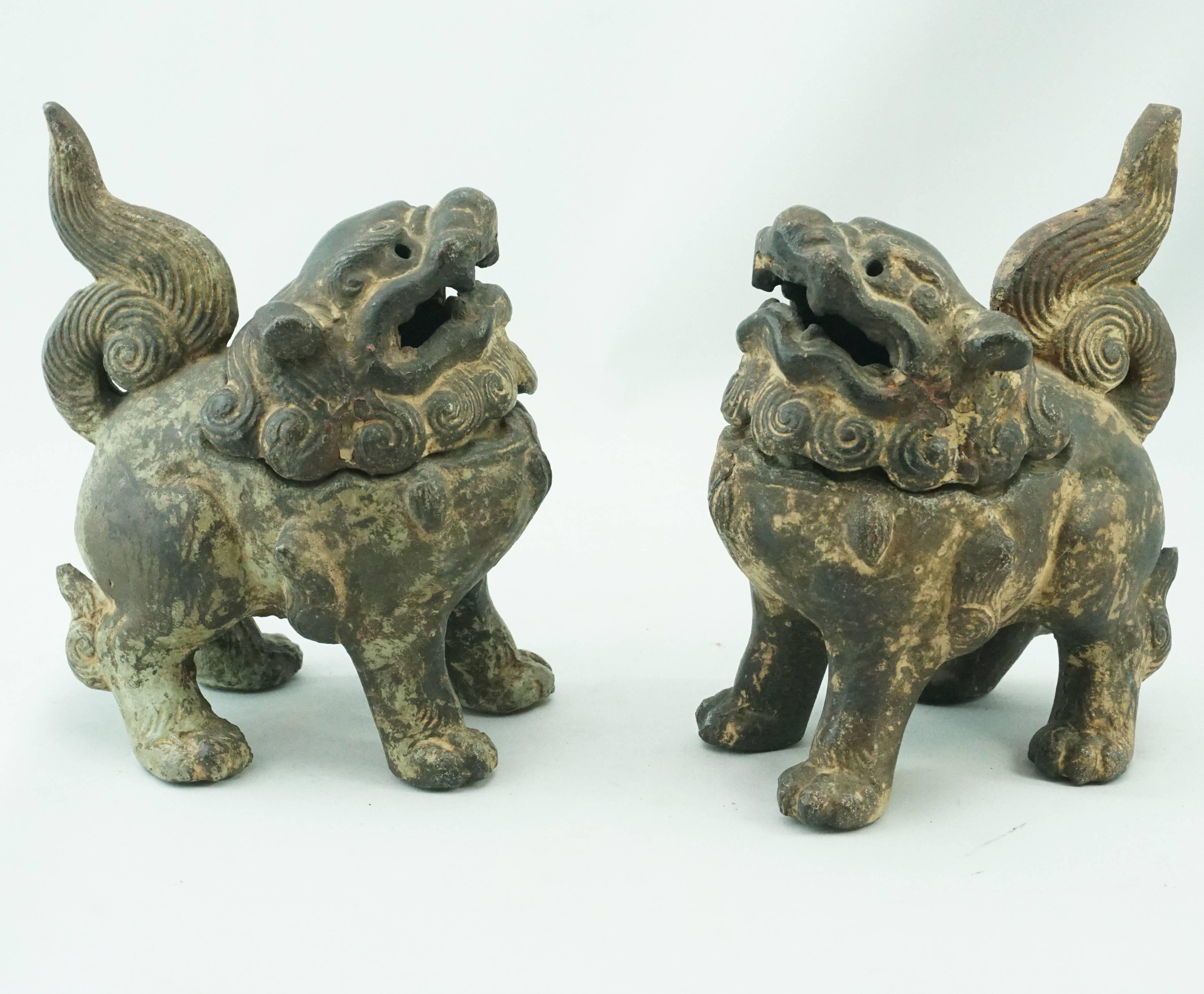 19th century Chinese cast iron foo dogs lions incense burners. Late Qing Dynasty. Whimsical packed with character iron incense burners for your personal temple, bedroom or living room. When operational; smoke pours out of the lions mouth and eyes