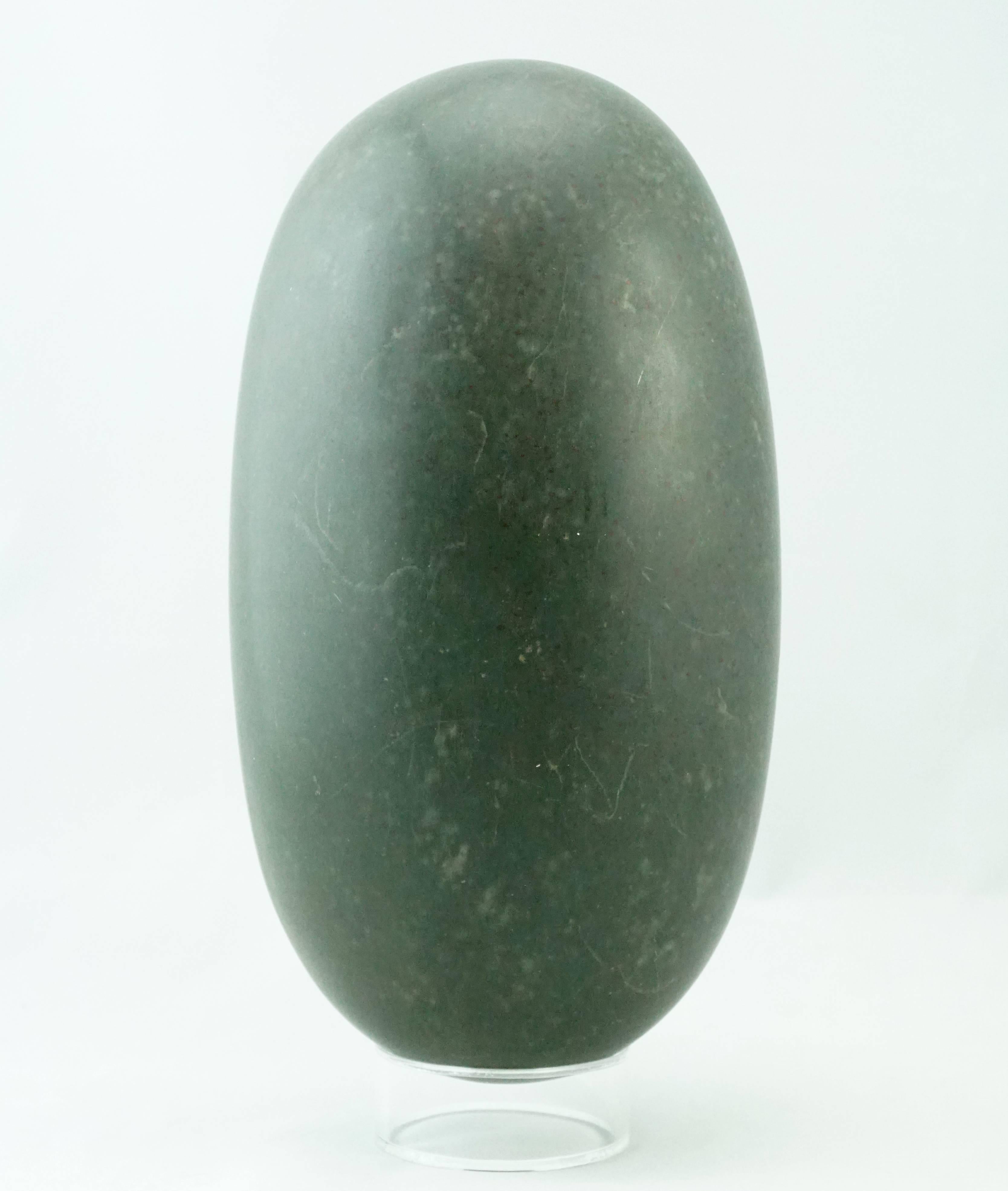 This magnificent lingam stone has a natural bird on Lilly Pads design that is very special. Please view photos. Stand included.

One of the most sacred icons of ancient and modern times, Shiva Lingam stones are found only in the Narmada River in the