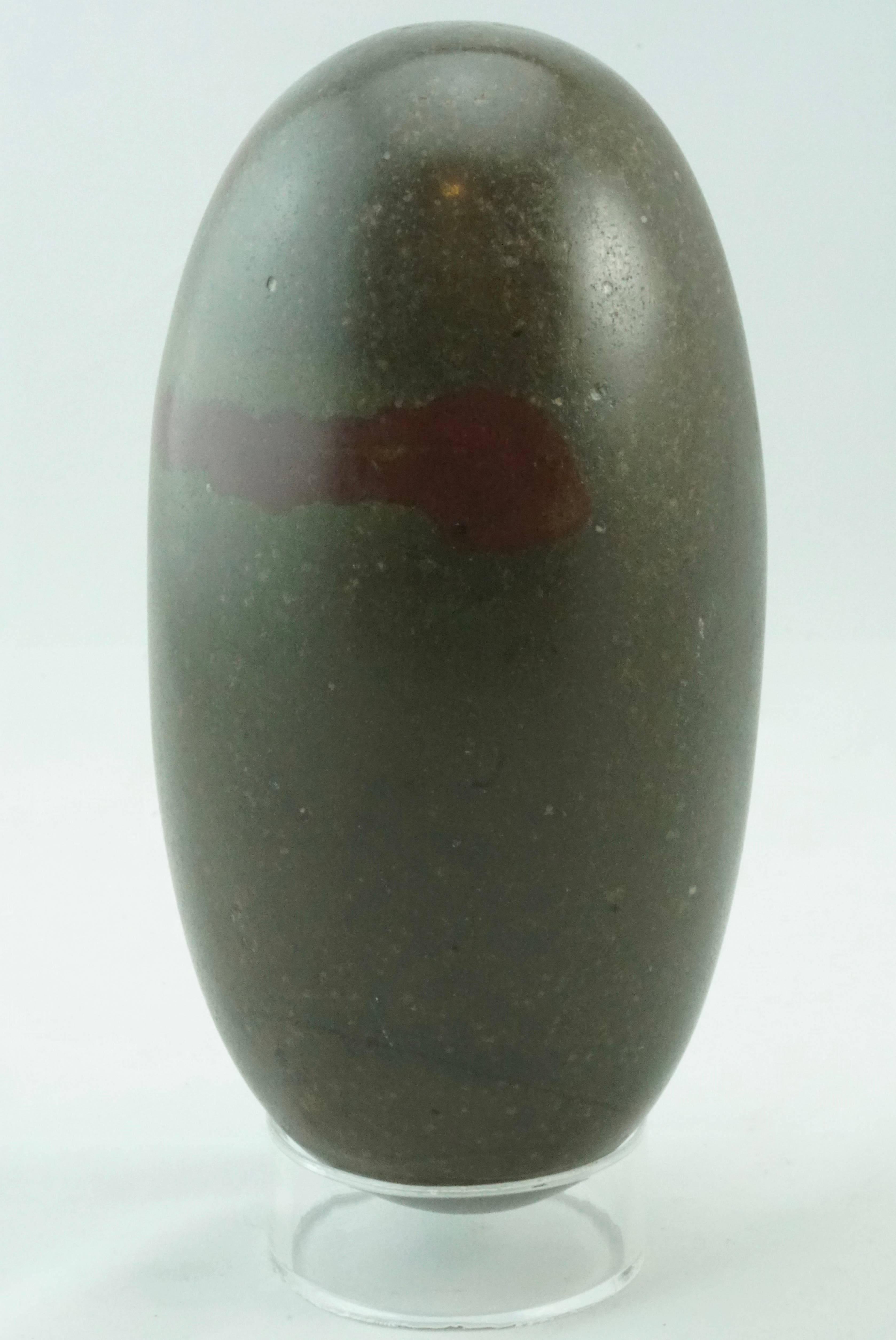 This magnificent lingam stone has a natural bird on Lilly Pads design that is very special. Please view photos. Stand included.  One of the most sacred icons of ancient and modern times, Shiva Lingam stones are found only in the Narmada River in the