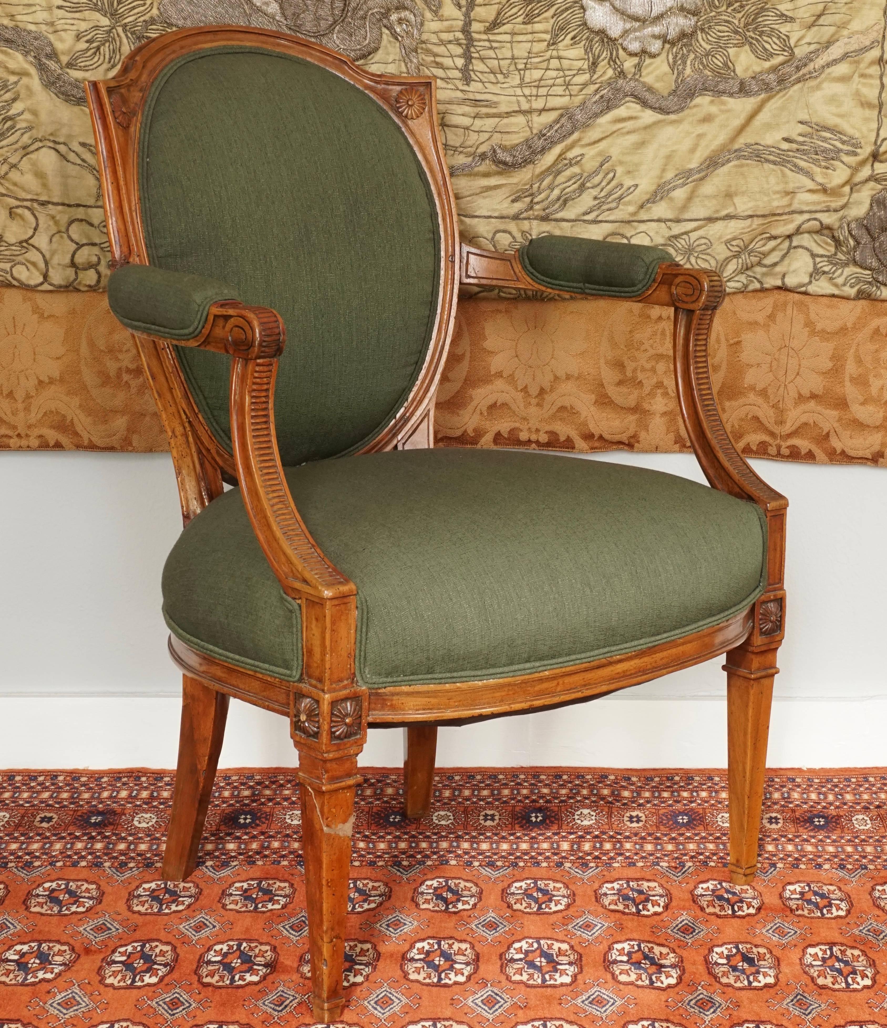 French Louis XVI walnut upholstered armchair Fauteuil, late 18th century. New green linen upholstery. Hand-carved walnut detail throughout sure to get glances and comments on its beauty and elegance. Sturdy and a very comfortable daily