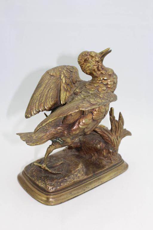 Wonderful animalier Paul Edwouard Delabrierre, 1860s bird French bronze!

A Paul Edwouard Delabrierre bird cocking his wings to ready for flight. This formidable bronze has a wonderful aged gilt gold patina. The detail is astounding with the