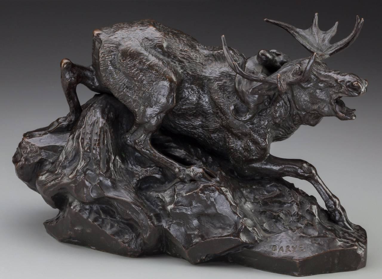 Antoine-Louis Barye (French, 1796-1875).

Élan surprised par un Lynx, circa 1876.
Bronze with brown patina 
14 inches (35.5 cm) long,
9 inches (22.9 cm) high.
Inscribed on base with Barbedienne foundry mark: Barye / F. Barbedienne