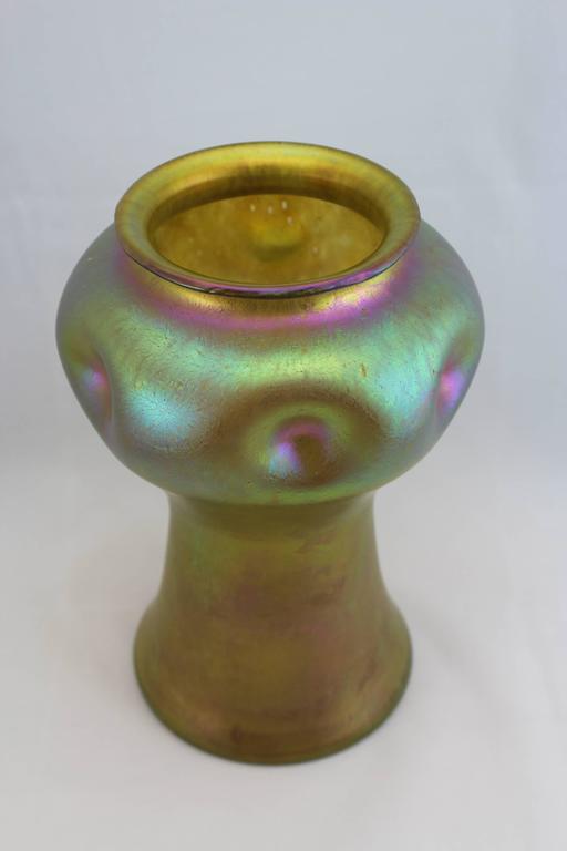 This popular and classic Loetz iridescent vase is what inspired Louis Comfort Tiffany to launch his favrille line which became his most popular style and put him on the map. Own a collectors piece that started high quality art glass.