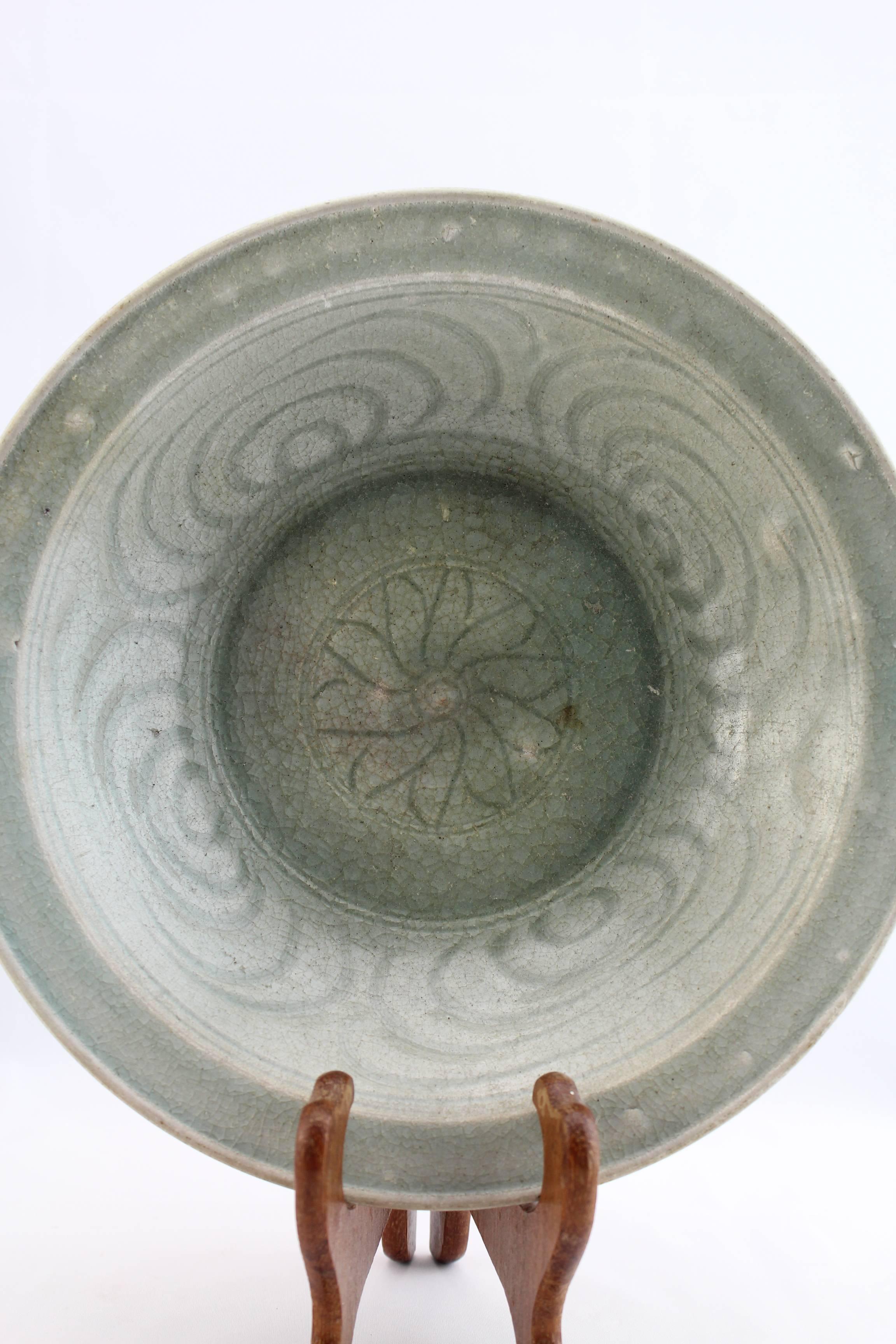 From Sukhothai or Sangkhalok (as named by the Chinese) this antique ceramic bowl is from the original kilns situated outside the wall of the ancient city. 

The production of ceramics began in the 13th century AD, possibly with the decline of