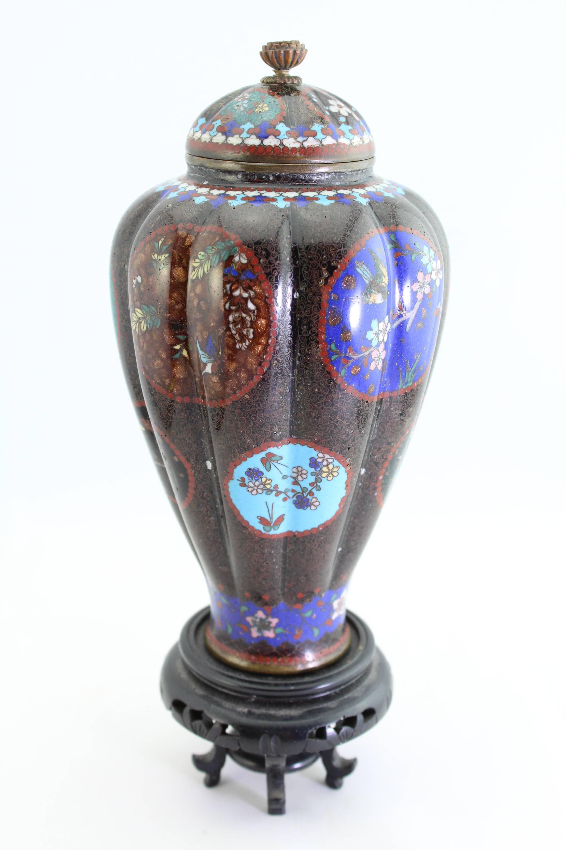 Direct from the Richard (Dick) Bass personal collection in Fort Worth TX. The Oil Billionaire and Mountaineer adventurer; First man ever complete the Seven Summits of the world.

A superb Meiji-era cloisonne vase featuring assorted flora on a black