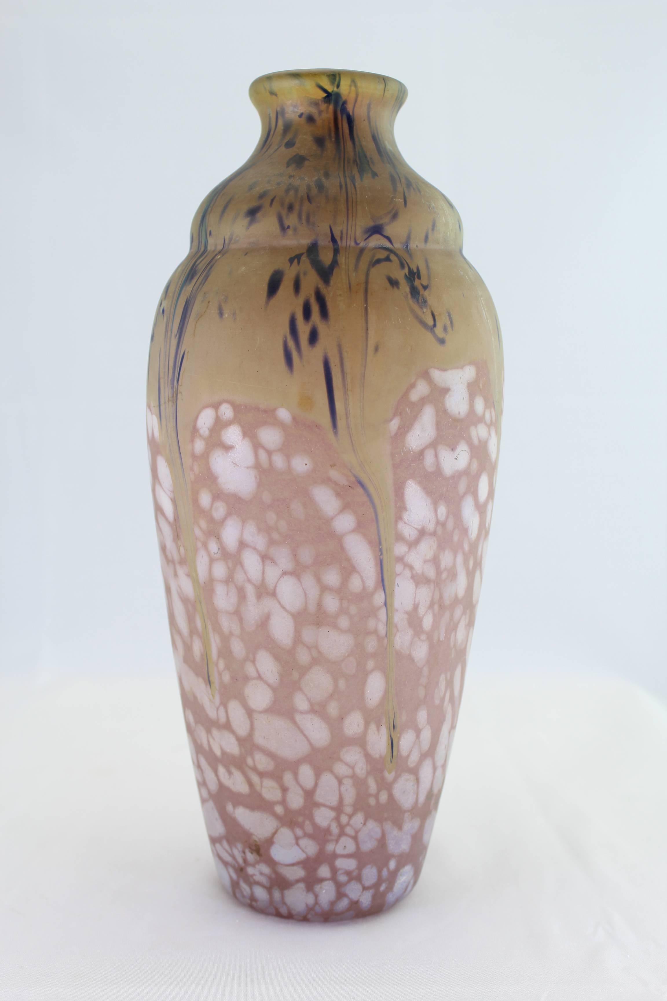 Rare and beautiful Art Deco variegated vase by Daum Nancy circa 1920. Almost 11 inches tall and pristine ready to display. This particular vase shows wild colors and designs when lighted from behind.

Signed: Daum Nancy with double cross or
