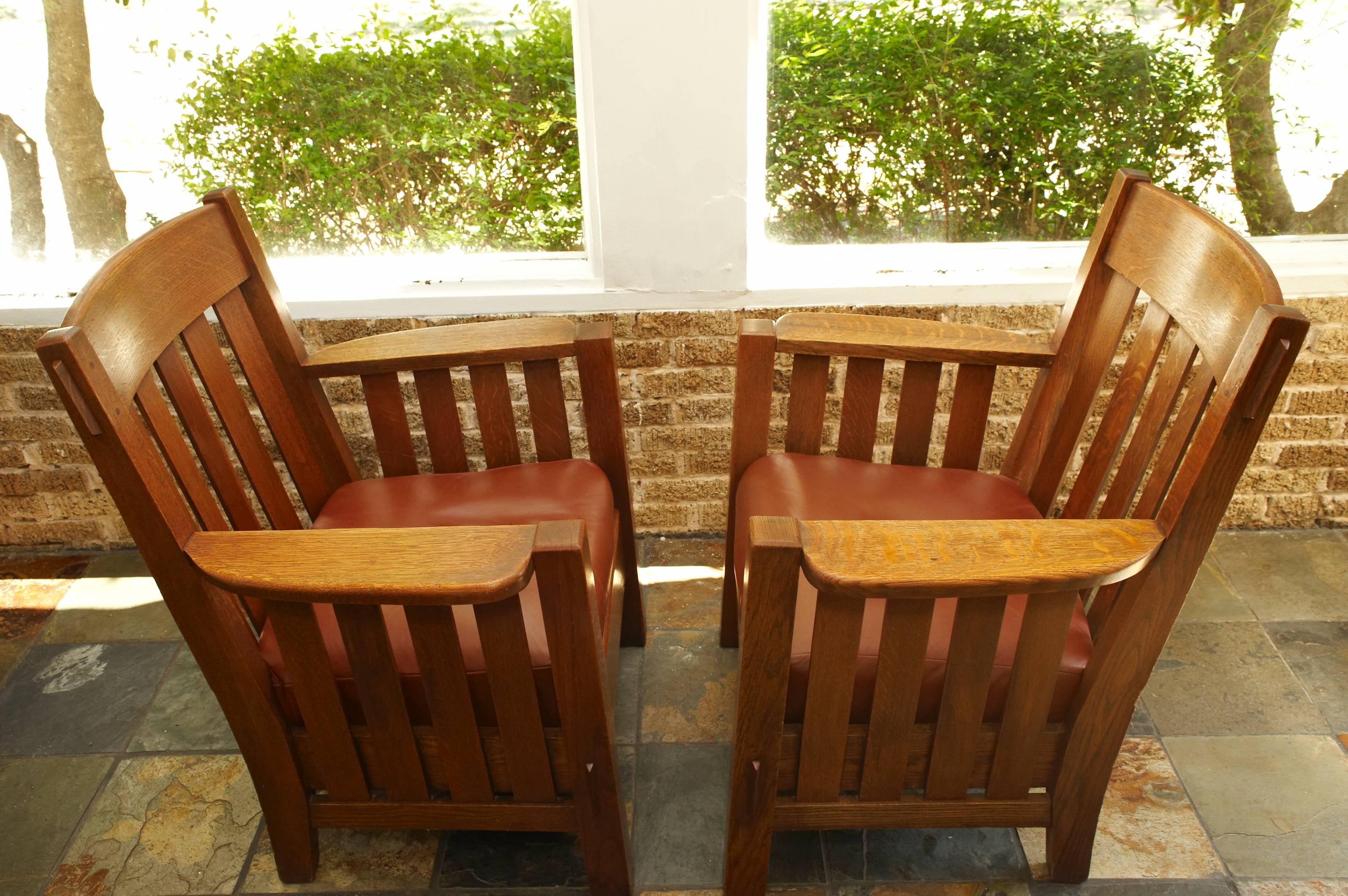 Pair of quarter sawn oak mission arts and crafts armchairs. Mortise and tendon construction. Circa 1907. Gustave Stickley era and quality.