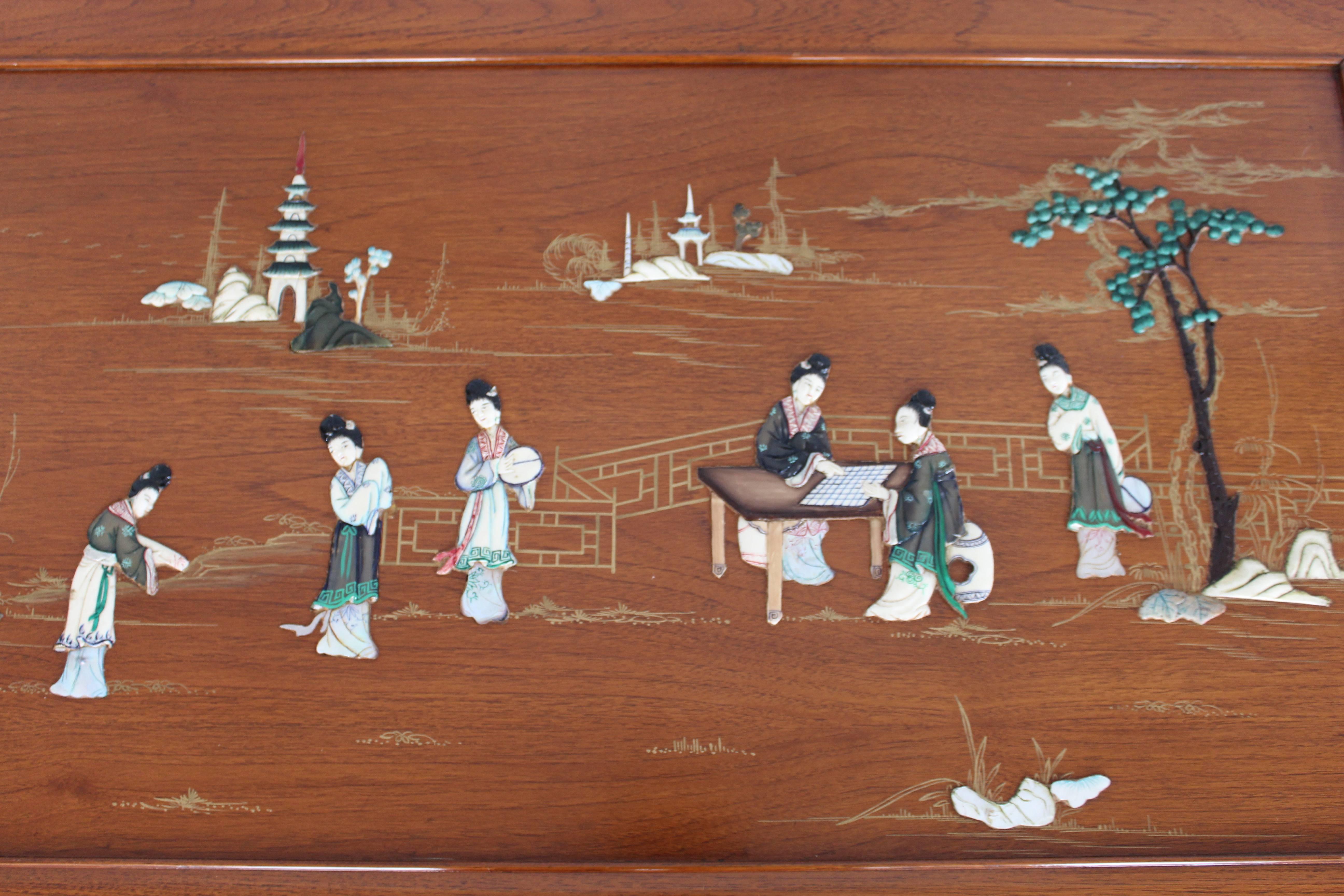 Solid rosewood carved constriction with inlays of bone, mother-of-pearl and jade (nephrite) depicting ladies dressed in robes in a landscape background. Solid wood top piece. 

Glass top not included as it has chips on corners.