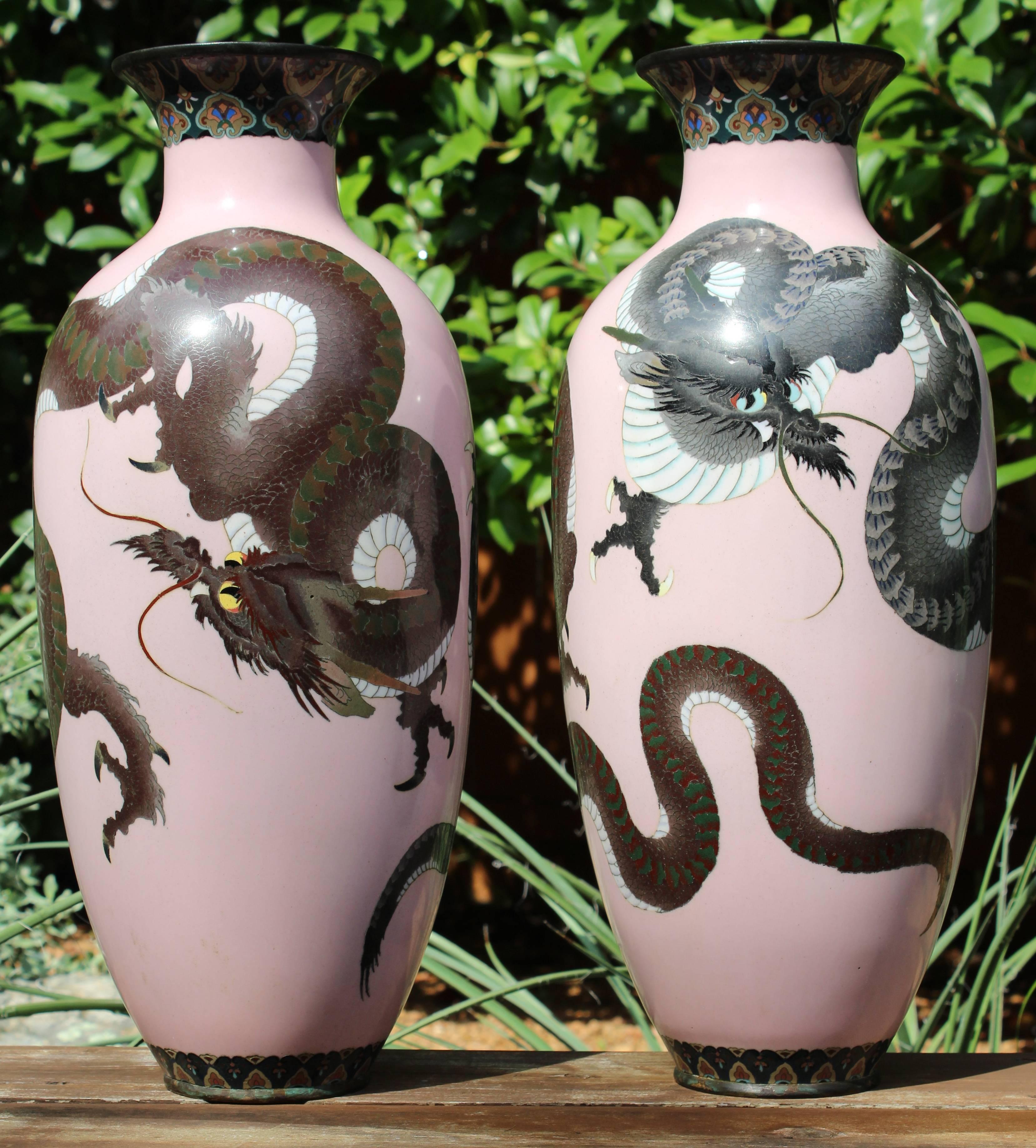 Pair of large Meiji Japanese cloisonné dragon vases. Rare monumental 18.5 inch high double dragons on pink backgrounds. 

Master workmanship in near mint condition with only wear commensurate of age.
 