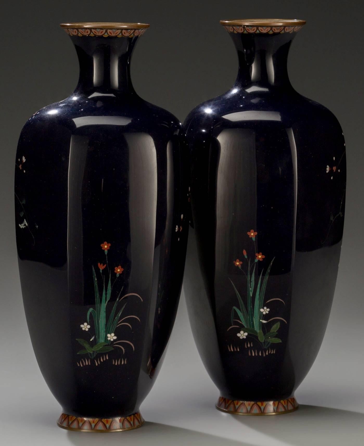 A pair of Japanese Cloisonné enamel hexagonal vases by Hayashi Chuzo Kodenji Workshop, Meiji period.
Marks: (Character mark to underside).
Measures: 12 inches high (30.5 cm).

Each vase decorated with a large hawk perched on blossoming branches