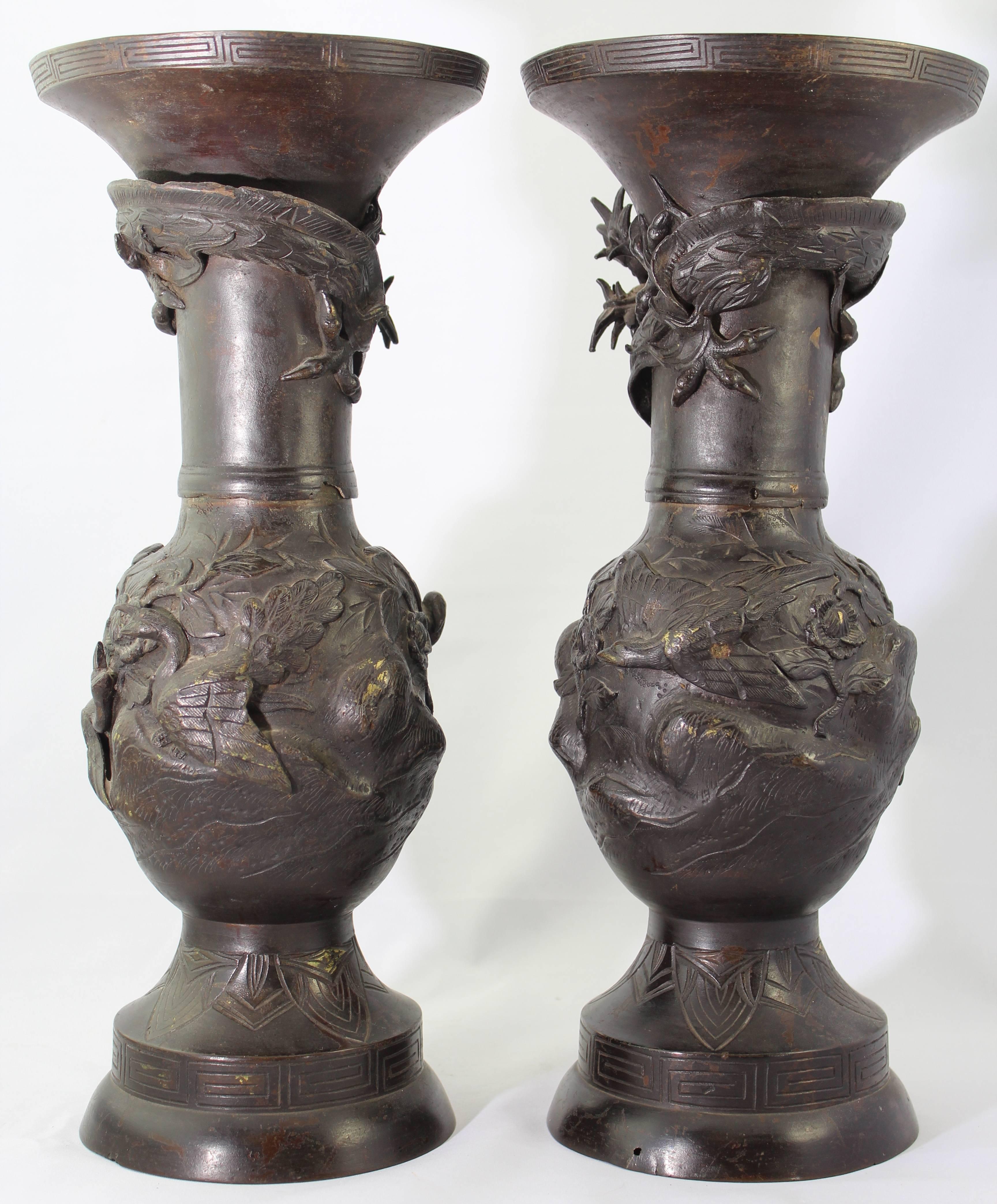 Pair Japanese Meiji Bronze dragon vases, 19th century.

Beautiful rich dark brown patina. Eagles, hawks, sparrows and dragons.

Wear commensurate of age: Losses and scratches. Displays beautifully.

Measures: Height 14.5 inches, width 6.25.