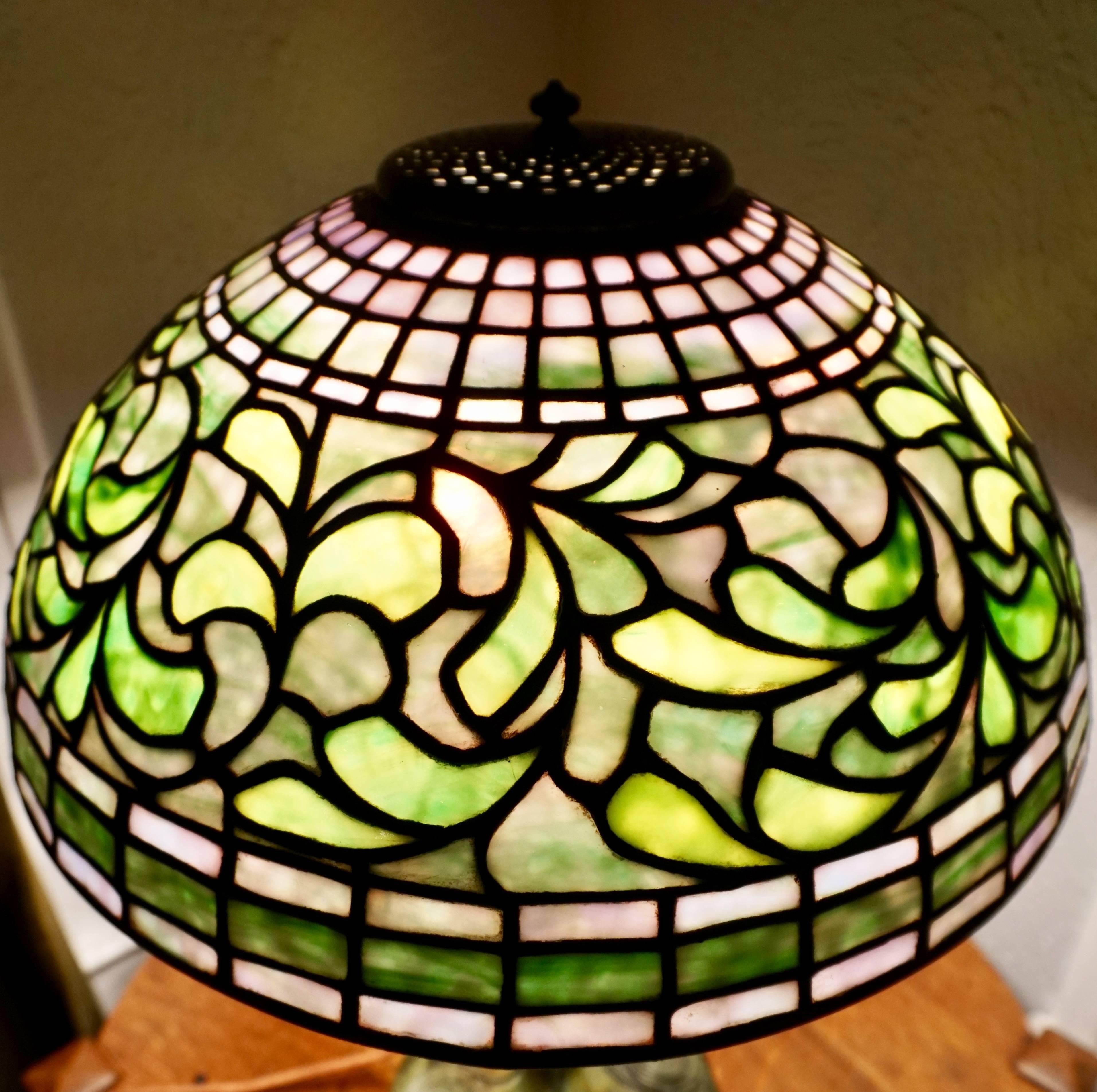 Tiffany Studios New York swirling leaf lampshade, circa 1910.

Shade Only! No heat cap or base.

Exceptional "Tiffany Studios New York 1445" shade with swirling leaf pattern with mottled greens, blues, creams and pinks. 

Very good