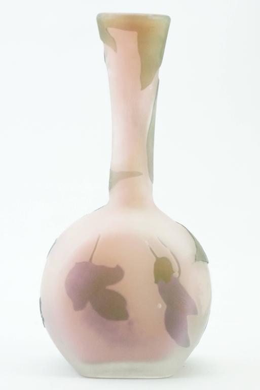 Emile Galle Cameo glass vases, circa 1900, Nancy, France, decorated with mauve, purple and green flowers on a pink shaded ground, signed 