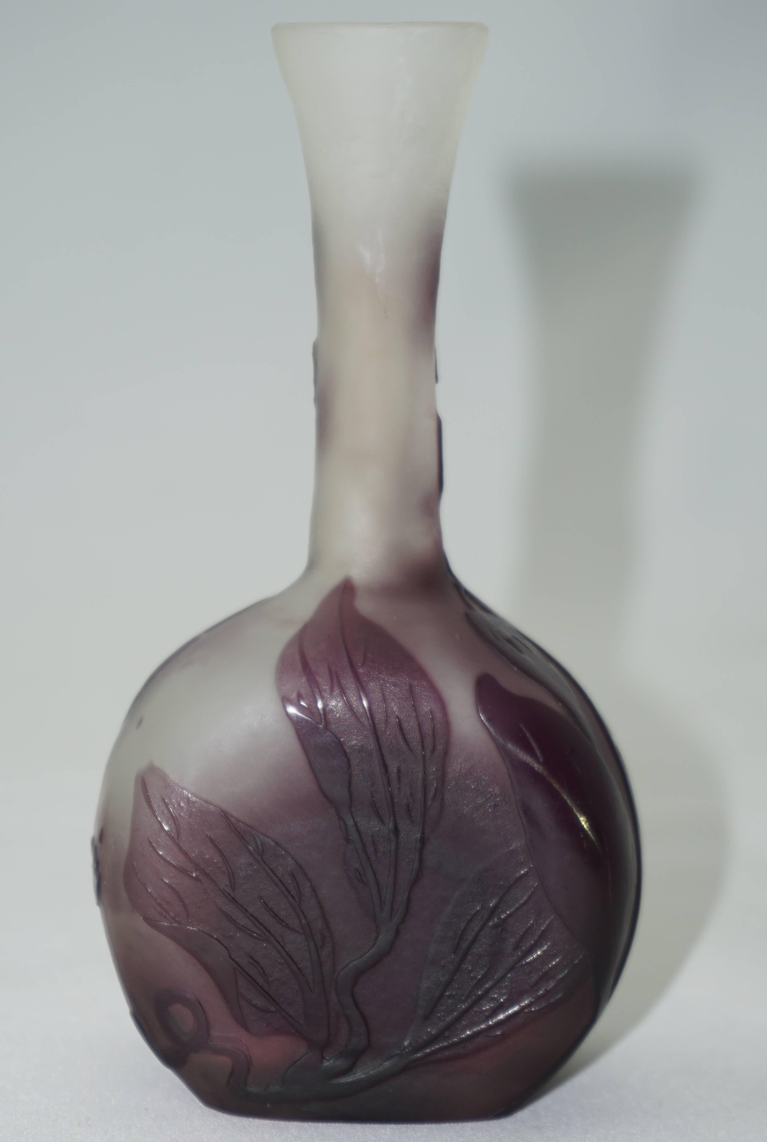 A beautiful Emile Galle cameo cabinet vase from Nancy, France, circa 1900. Carved foliage in Lavenders and purples with pinks on a creamy background.

Marked Galle

Measure: Height 5.25
Width 2.75
Depth 1.75

Please consider Avantiques