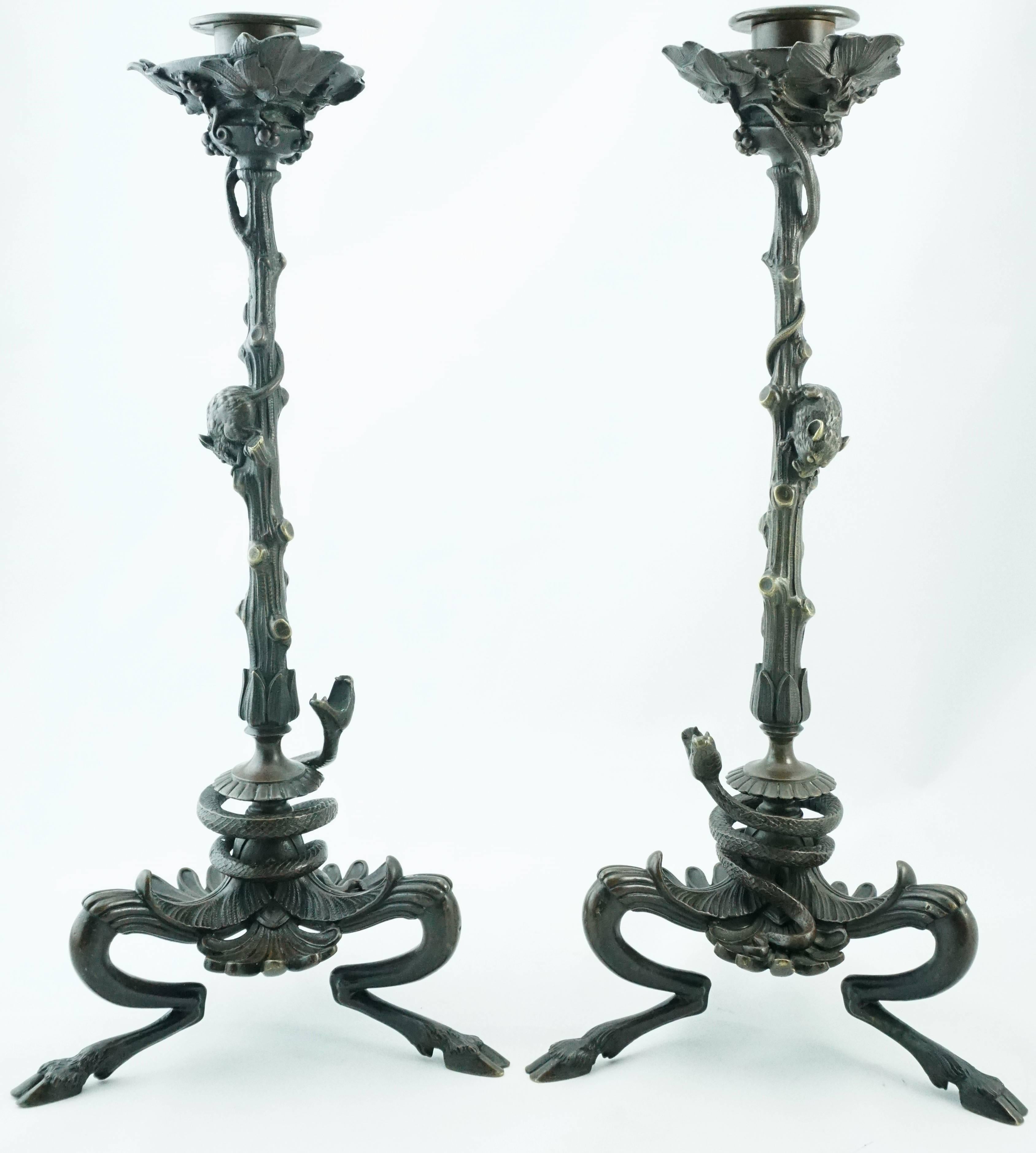 Victor Paillard pair of bronze snake and mouse candlelabra, circa 1865. A beautiful pair of single one light candlestick candelabra depicting coiled viper snakes ready to strike descending mice or mouses atop three legged bases in exquisite detail