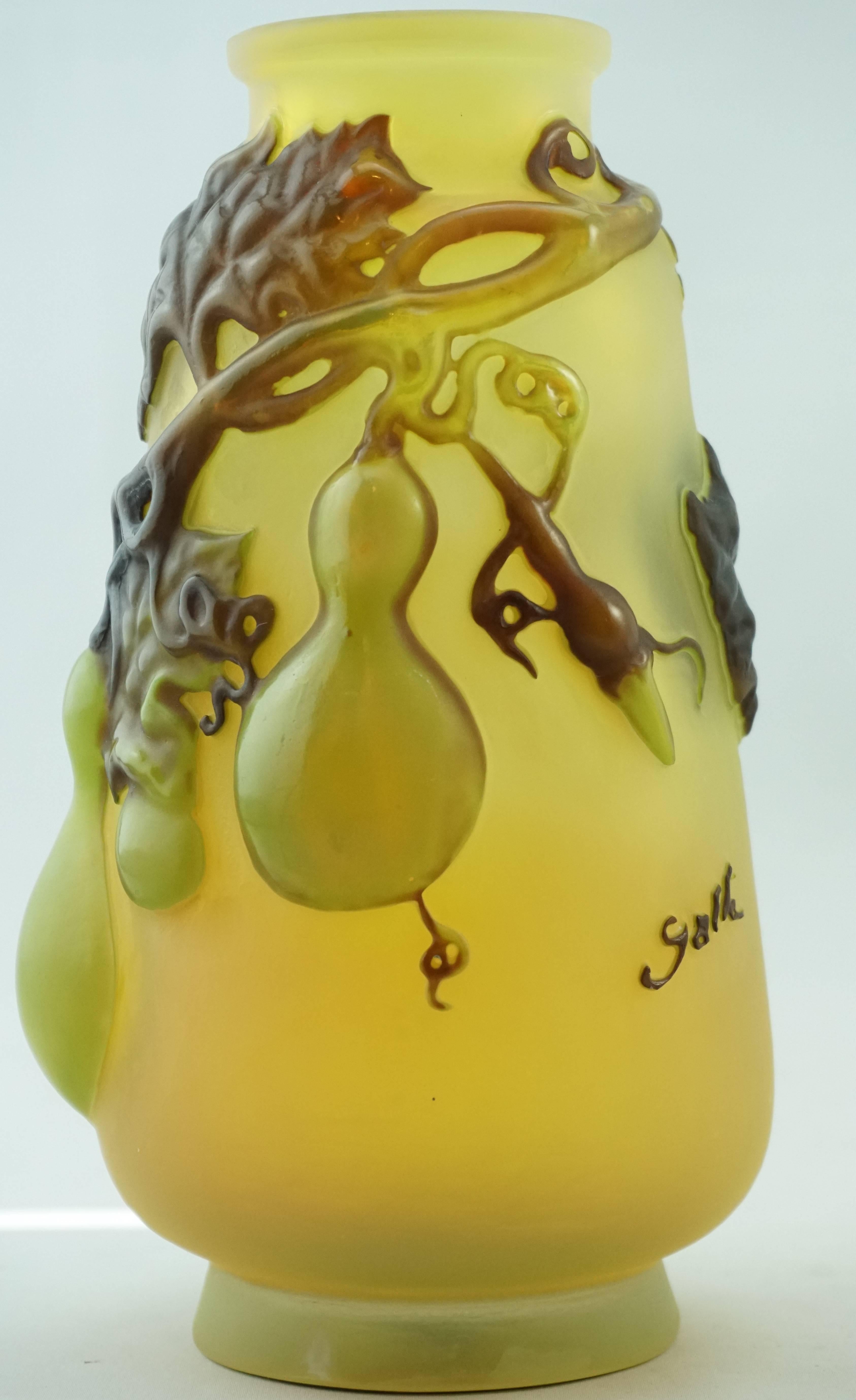 Emile Galle blown out gourd and vines vase. Blown out vases are rare and very desirable. This mold blown model is an exceptional example because the gourds are blown out quite far and are truly three-dimensional. The color on the gourds is