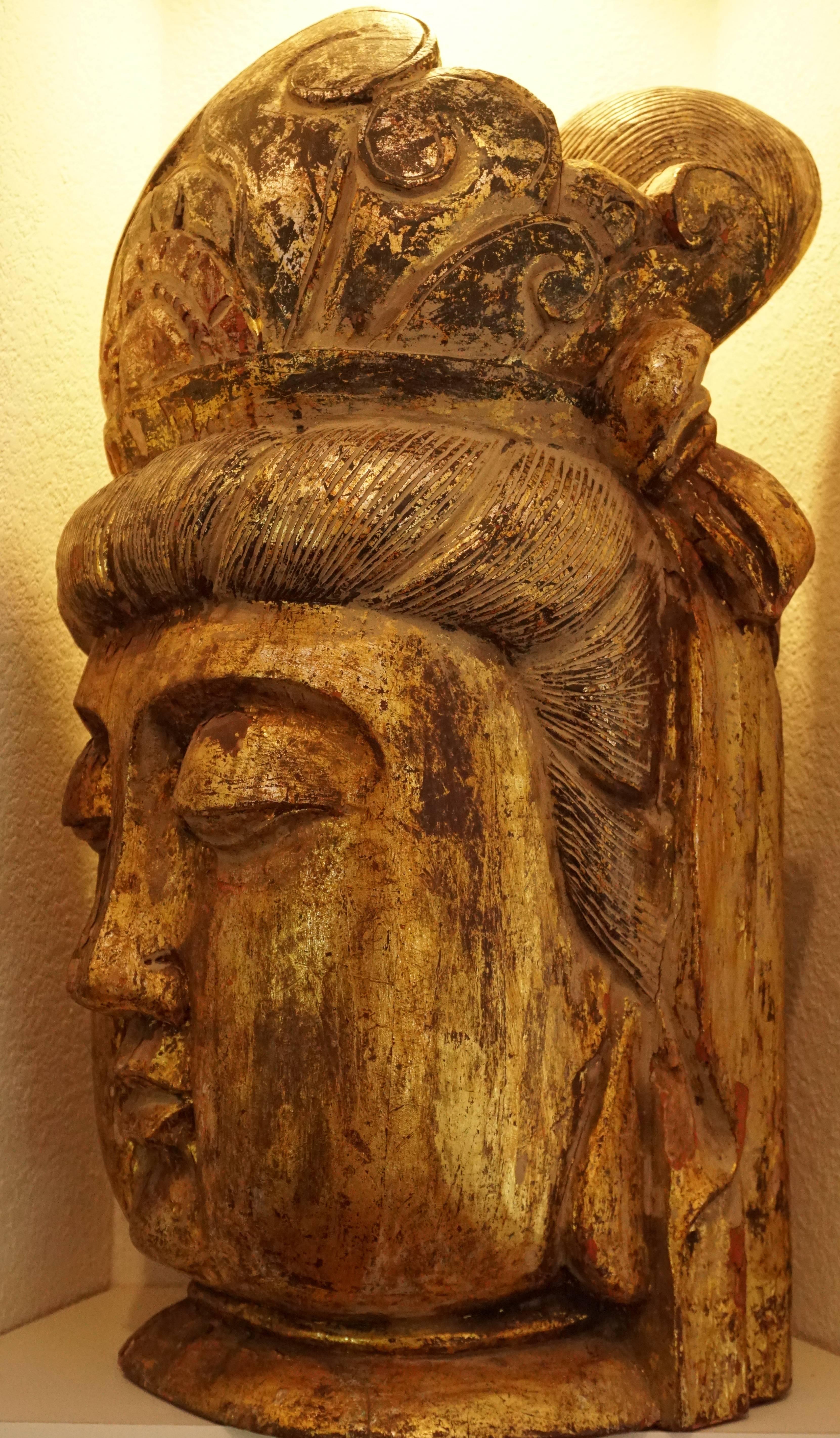 carved wooden buddha head