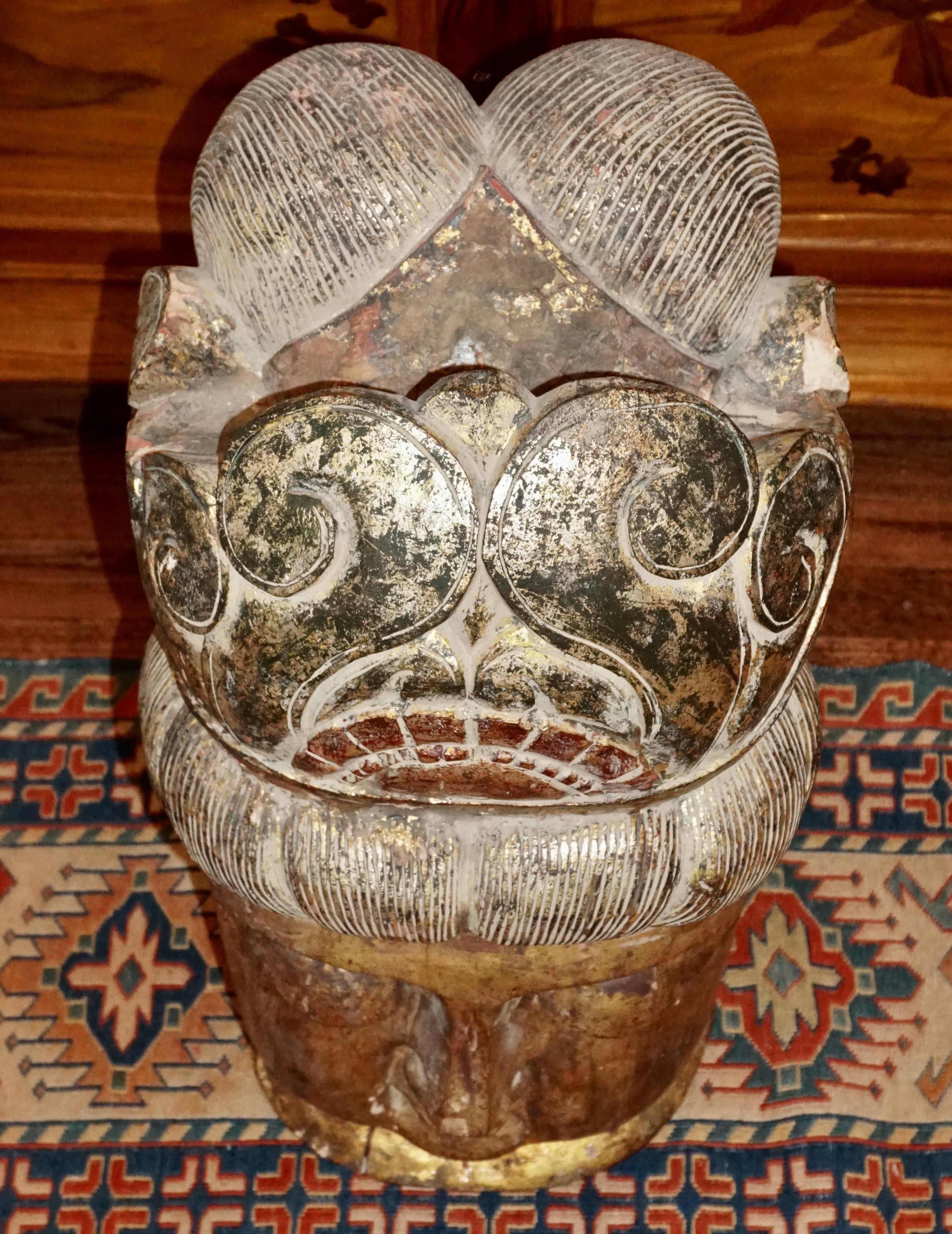 large wooden buddha head
