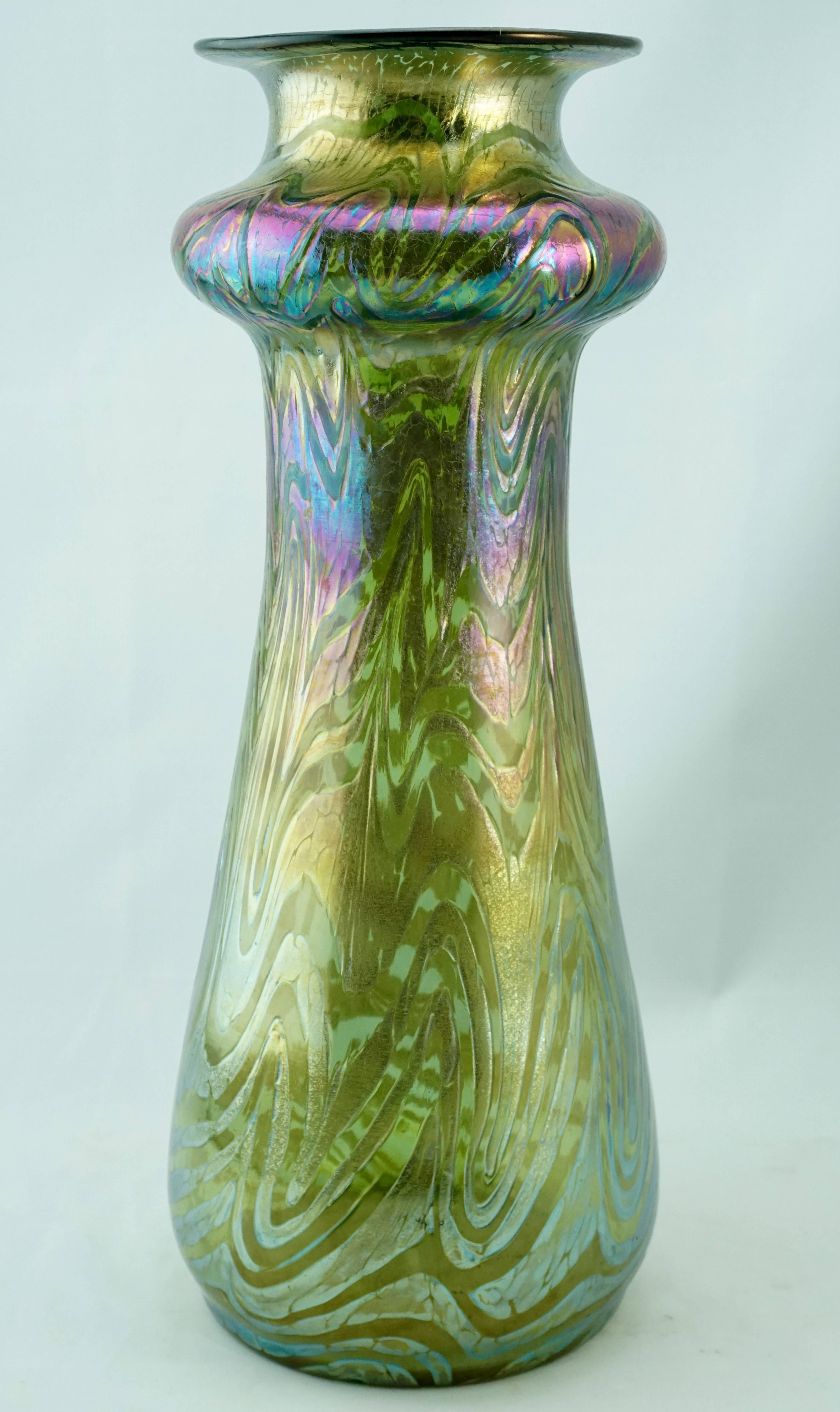 Loetz Austria large Art Nouveau Phaenomen iridescent vase, circa 1900. A green background with silver, blue, gold, purple, orange and red iridescent swirls that made Louis Comfort Tiffany jealous! Very fat and tall vase at 14.25