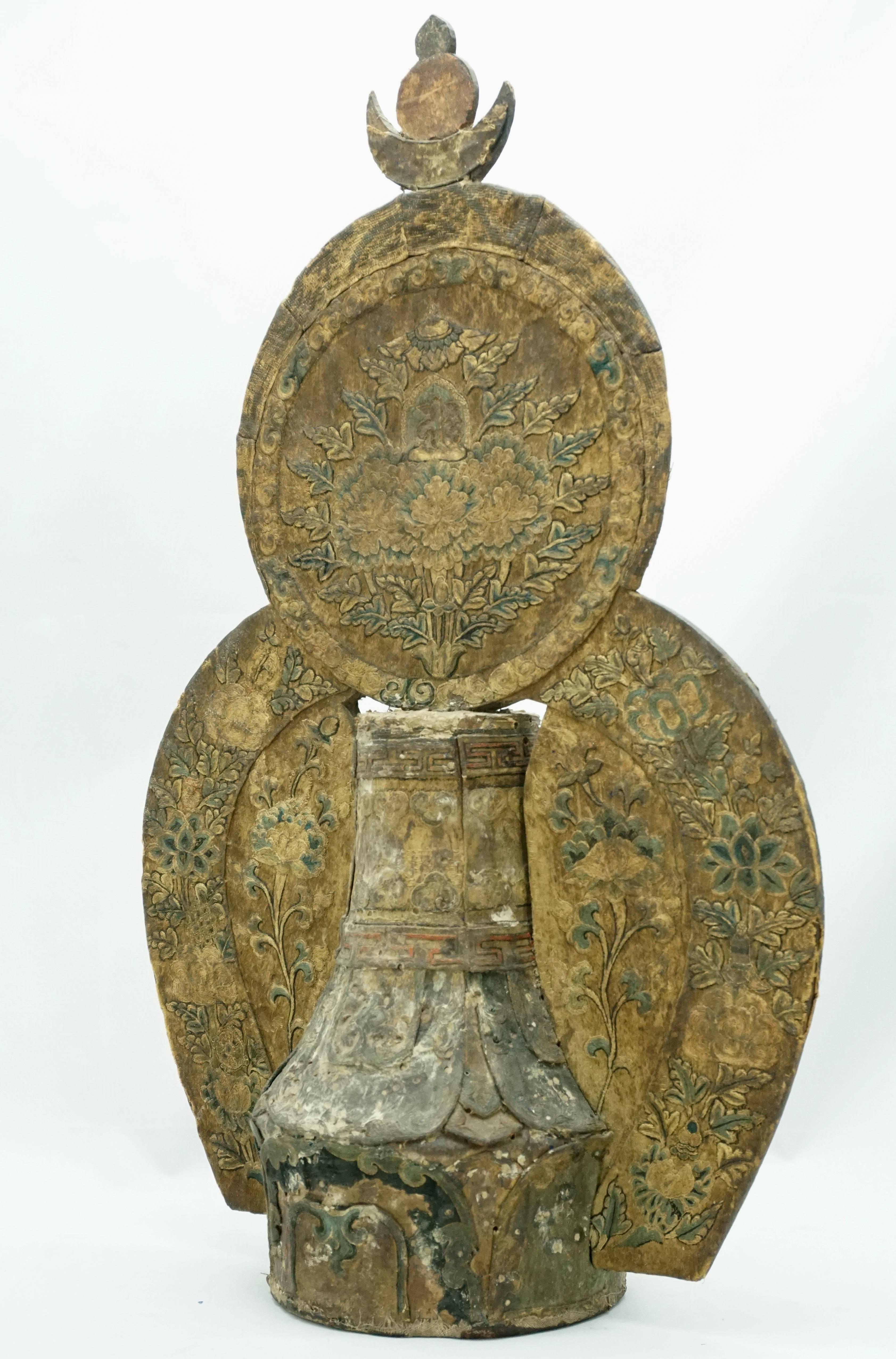 Tibetan priest's crown top Buddha Stupa in carved wood with embroidered silk appliques, surmounted by a flaming crescent moon, sun and jewel symbol. This would represent Buddha statue, his seven realms, the elements and sit on the alter in a