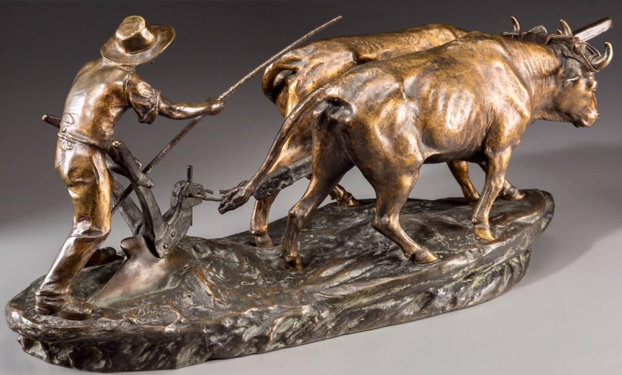 Edouard Drouot (French)
farmer and bulls plowing the field. Late 19th century.
Large, moving and heavy bronze with brown and copper patina. Amazing French animalier rendition of working bulls or cows.

Inscribed on base with E Drouot and seal