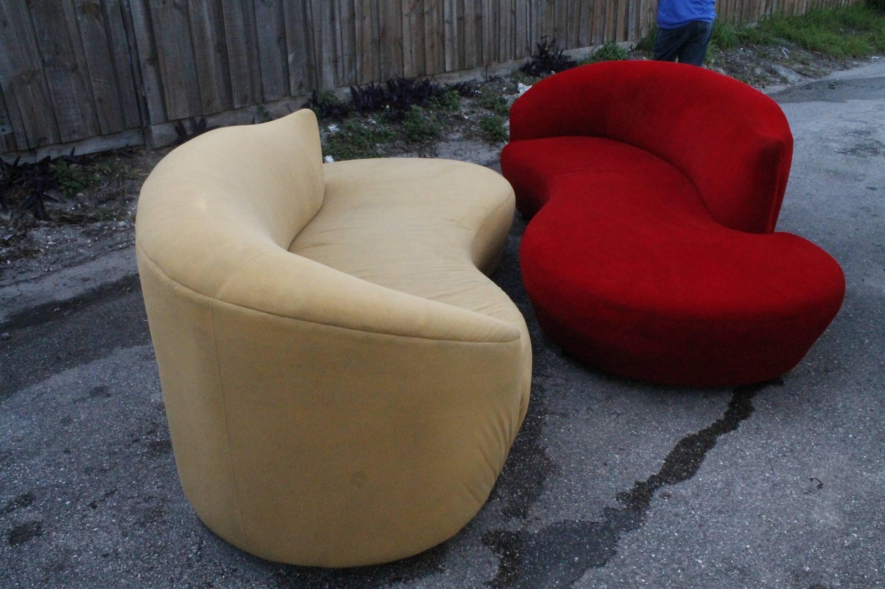 Great vintage Hollywood Regency pair of cloud sofas. Free form curved, original ultrasuede fabric with chrome feet. When placed together or on opposite walls they form the Yin Yang symbol. These have both been professionally steam cleaned the day