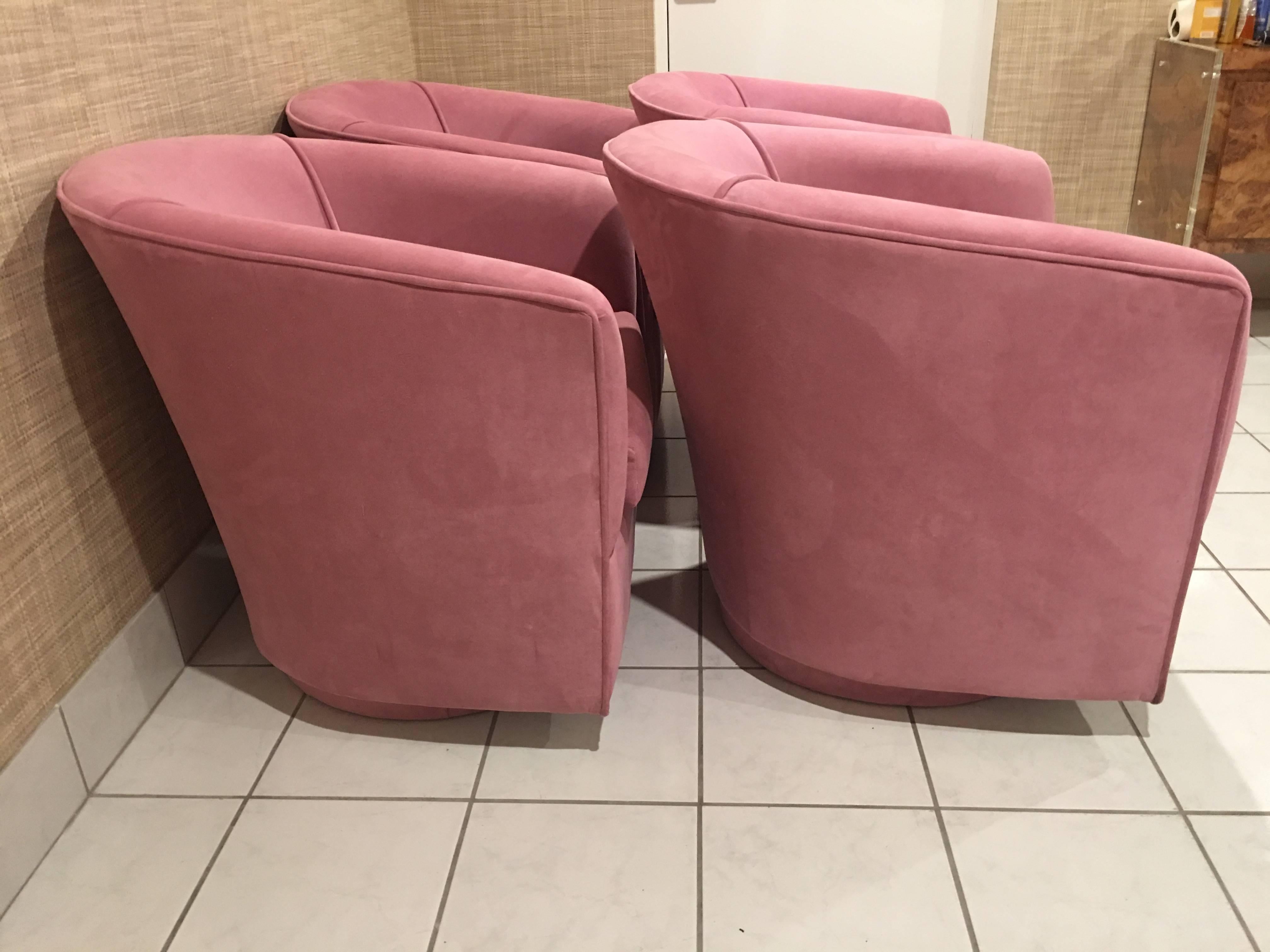 Set of four, vintage swivel armchairs with platform round base. These have there original pink mauve suede upholstery. There are no tips or tears however there might be some light soiling. In the style of Milo Baughman. Depth listed is cushion depth.